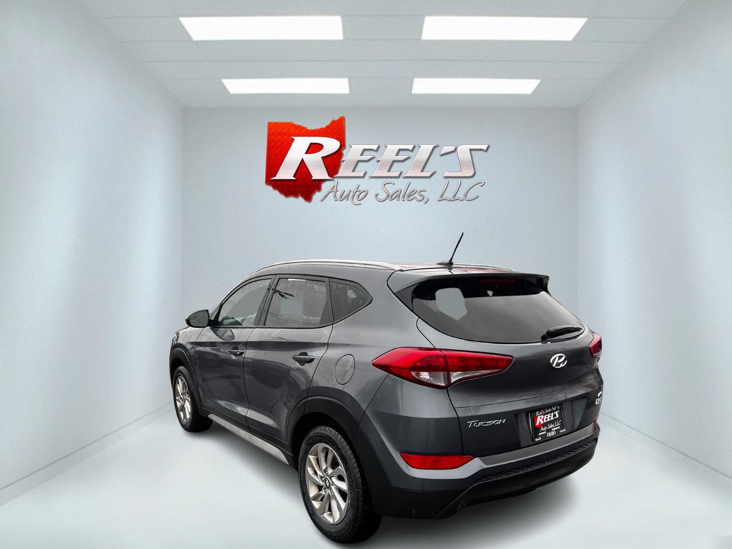 2017 Gray /Black Hyundai Tucson SE w/Popular Package AWD (KM8J3CA43HU) with an 2.0L I4 DOHC 16V engine, 6 Speed Auto transmission, located at 11115 Chardon Rd. , Chardon, OH, 44024, (440) 214-9705, 41.580246, -81.241943 - This 2017 Hyundai Tucson SE AWD is a well-rounded compact SUV that offers a balance of efficiency, technology, and functionality. Powered by a 2.0 I4 GDI engine and equipped with a 6-speed automatic transmission, it provides a commendable fuel efficiency of 26 MPG on the highway. This vehicle includ - Photo#17