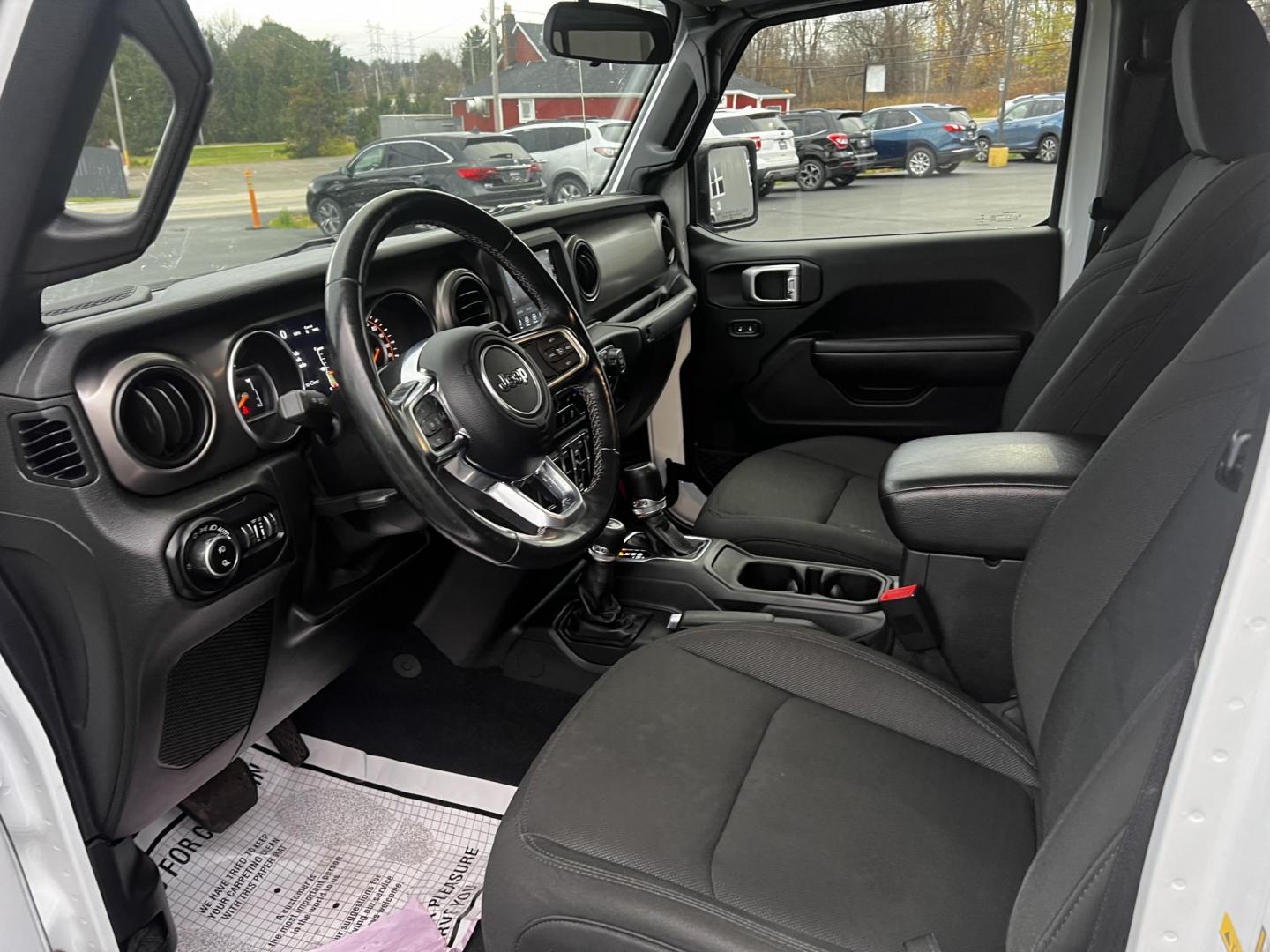 2020 White /Black Jeep Gladiator Sport S (1C6HJTAGXLL) with an 3.6L V6 DOHC 24V engine, 8-Speed Automatic transmission, located at 11115 Chardon Rd. , Chardon, OH, 44024, (440) 214-9705, 41.580246, -81.241943 - This 2020 Jeep Gladiator Sport S is a versatile midsize pickup renowned for its robust capabilities and modern features. Powered by a 3.6L Pentastar V6 engine paired with an 8-speed automatic transmission, it delivers a solid highway mileage of 22 MPG. Noteworthy features include a 7.0" touchscreen - Photo#15