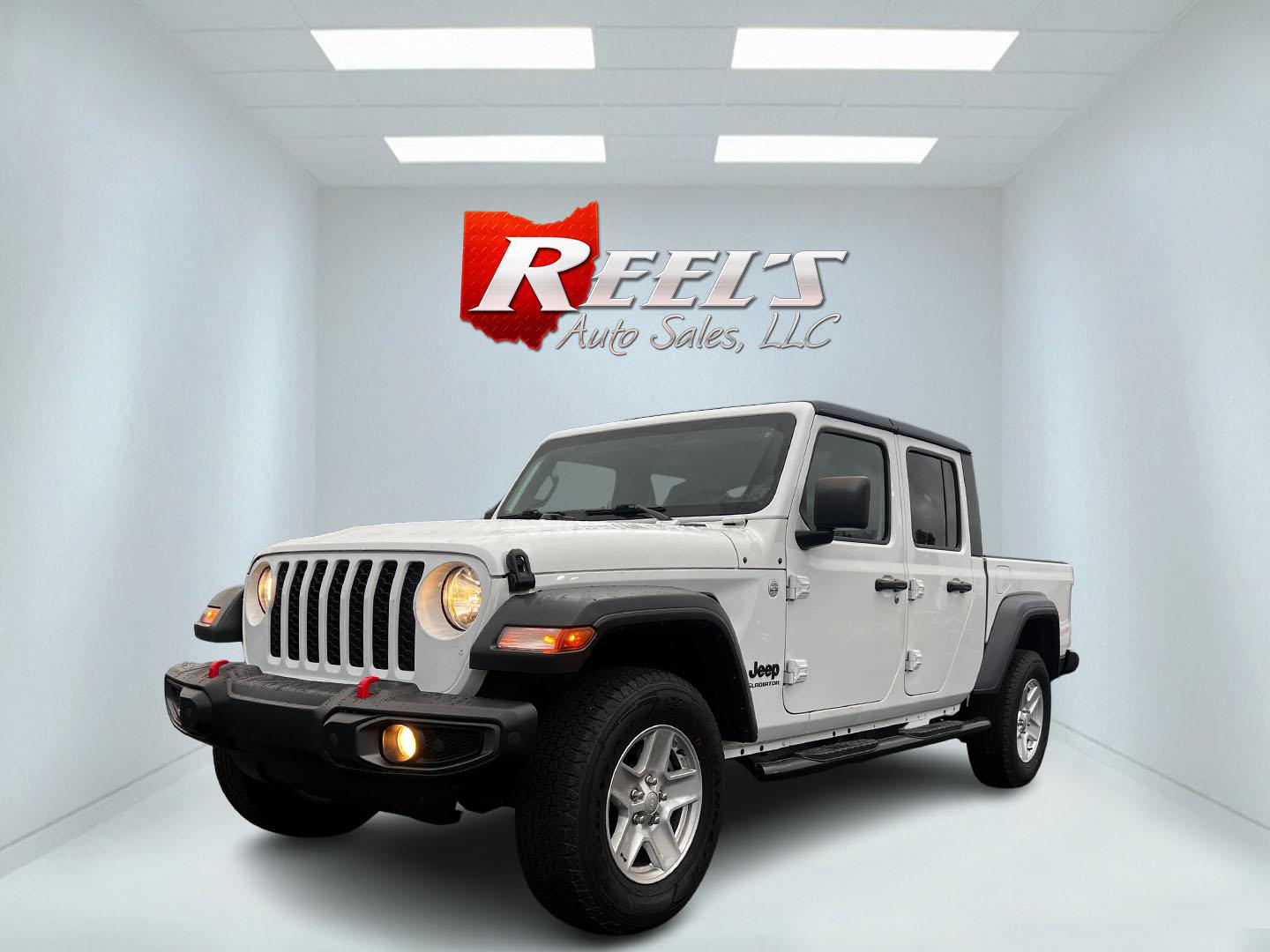 2020 White /Black Jeep Gladiator Sport S (1C6HJTAGXLL) with an 3.6L V6 DOHC 24V engine, 8-Speed Automatic transmission, located at 11115 Chardon Rd. , Chardon, OH, 44024, (440) 214-9705, 41.580246, -81.241943 - This 2020 Jeep Gladiator Sport S is a versatile midsize pickup renowned for its robust capabilities and modern features. Powered by a 3.6L Pentastar V6 engine paired with an 8-speed automatic transmission, it delivers a solid highway mileage of 22 MPG. Noteworthy features include a 7.0" touchscreen - Photo#0
