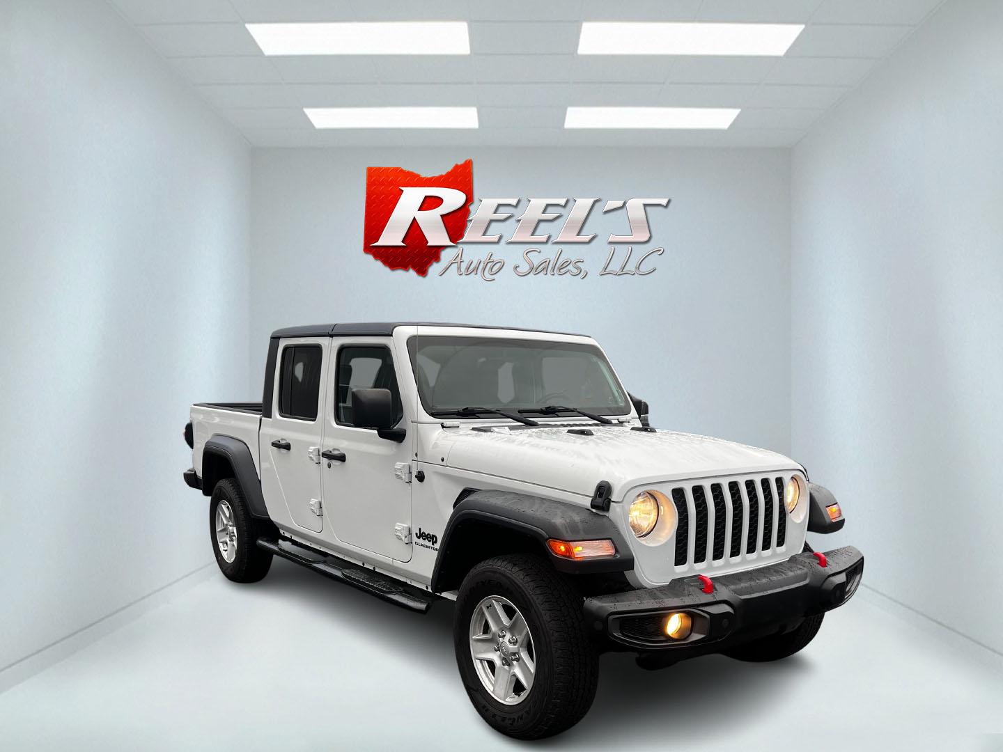 2020 White /Black Jeep Gladiator Sport S (1C6HJTAGXLL) with an 3.6L V6 DOHC 24V engine, 8-Speed Automatic transmission, located at 11115 Chardon Rd. , Chardon, OH, 44024, (440) 214-9705, 41.580246, -81.241943 - This 2020 Jeep Gladiator Sport S is a versatile midsize pickup renowned for its robust capabilities and modern features. Powered by a 3.6L Pentastar V6 engine paired with an 8-speed automatic transmission, it delivers a solid highway mileage of 22 MPG. Noteworthy features include a 7.0" touchscreen - Photo#2