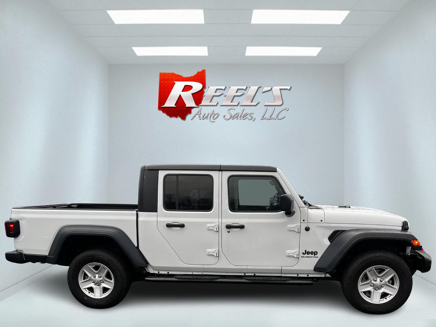 2020 White /Black Jeep Gladiator Sport S (1C6HJTAGXLL) with an 3.6L V6 DOHC 24V engine, 8-Speed Automatic transmission, located at 11115 Chardon Rd. , Chardon, OH, 44024, (440) 214-9705, 41.580246, -81.241943 - This 2020 Jeep Gladiator Sport S is a versatile midsize pickup renowned for its robust capabilities and modern features. Powered by a 3.6L Pentastar V6 engine paired with an 8-speed automatic transmission, it delivers a solid highway mileage of 22 MPG. Noteworthy features include a 7.0" touchscreen - Photo#4