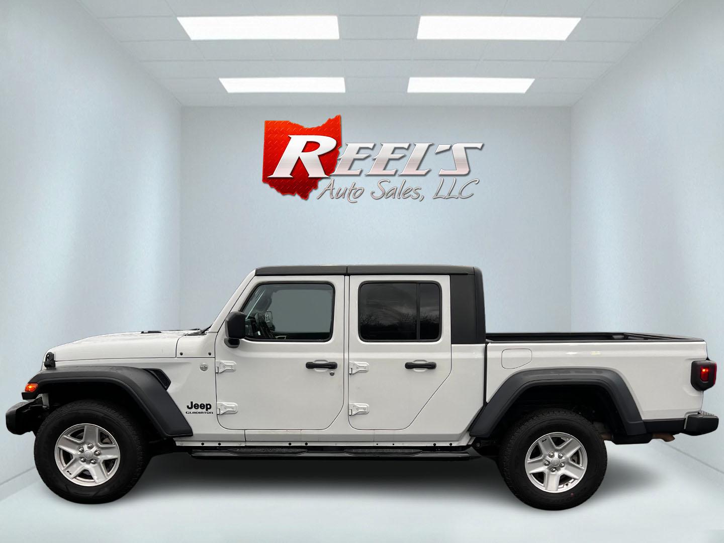2020 White /Black Jeep Gladiator Sport S (1C6HJTAGXLL) with an 3.6L V6 DOHC 24V engine, 8-Speed Automatic transmission, located at 11115 Chardon Rd. , Chardon, OH, 44024, (440) 214-9705, 41.580246, -81.241943 - This 2020 Jeep Gladiator Sport S is a versatile midsize pickup renowned for its robust capabilities and modern features. Powered by a 3.6L Pentastar V6 engine paired with an 8-speed automatic transmission, it delivers a solid highway mileage of 22 MPG. Noteworthy features include a 7.0" touchscreen - Photo#9