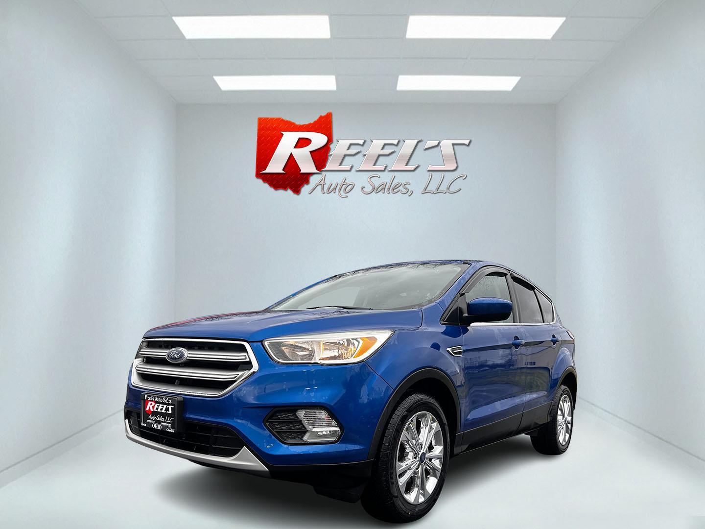 2017 Blue /Black Ford Escape SE FWD (1FMCU0GD2HU) with an 1.5L L4 DOHC 16V engine, 6A transmission, located at 547 E. Main St., Orwell, OH, 44076, (440) 437-5893, 41.535435, -80.847855 - This 2017 Ford Escape SE FWD with the 1.5-liter turbocharged I4 EcoBoost engine and 6-speed automatic transmission is a compact SUV known for its balance of efficiency and performance, offering 30 MPG on the highway. It comes equipped with features such as daytime running lights, dusk-sensing headli - Photo#0