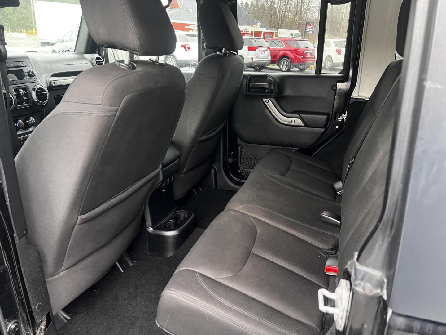 2015 Black /Black Jeep Wrangler Unlimited Sport 4WD (1C4BJWDG6FL) with an 3.6L V6 DOHC 24V FFV engine, located at 11115 Chardon Rd. , Chardon, OH, 44024, (440) 214-9705, 41.580246, -81.241943 - Photo#28