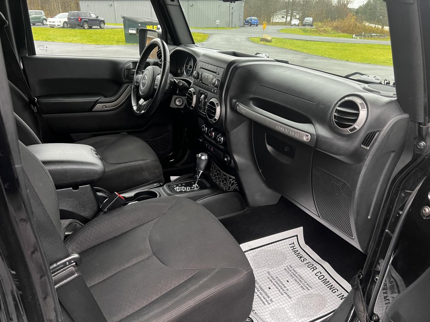 2015 Black /Black Jeep Wrangler Unlimited Sport 4WD (1C4BJWDG6FL) with an 3.6L V6 DOHC 24V FFV engine, located at 11115 Chardon Rd. , Chardon, OH, 44024, (440) 214-9705, 41.580246, -81.241943 - Photo#35