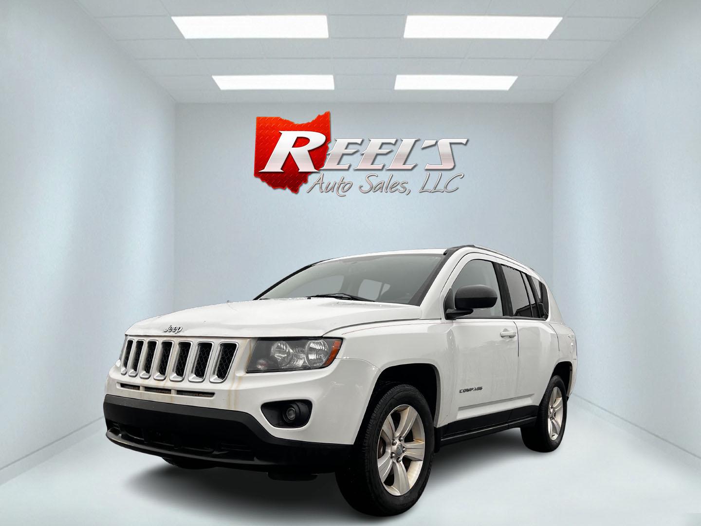 2016 White /Black Jeep Compass Sport 4WD (1C4NJDBB0GD) with an 2.4L I4 DOHC 16V engine, 6 Speed Auto transmission, located at 11115 Chardon Rd. , Chardon, OH, 44024, (440) 214-9705, 41.580246, -81.241943 - Photo#0
