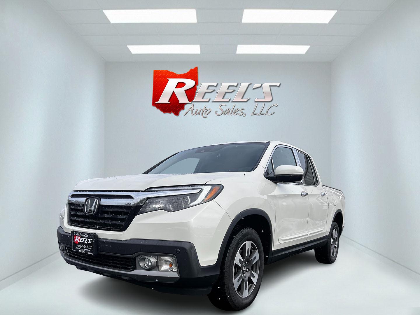 2017 White /Black Honda Ridgeline RTL-E AWD (5FPYK3F72HB) with an 3.5L V6 SOHC 24V engine, 6A transmission, located at 11115 Chardon Rd. , Chardon, OH, 44024, (440) 214-9705, 41.580246, -81.241943 - This 2017 Honda Ridgeline RTL-E AWD is a versatile mid-size pickup truck featuring a 3.5L Earthdreams V6 engine paired with a 6-speed automatic transmission, providing a respectable 25 MPG on the highway. Its upscale leather interior includes heated front seats and a heated steering wheel for added - Photo#0