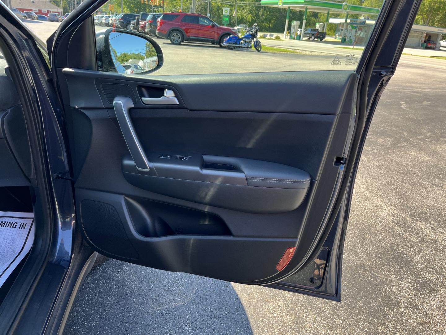 2022 Blue /Black Kia Sportage LX AWD (KNDPMCAC6N7) with an 2.4L I4 DOHC 24V engine, Automatic transmission, located at 11115 Chardon Rd. , Chardon, OH, 44024, (440) 214-9705, 41.580246, -81.241943 - 2022 Kia Sportage LX AWD – Practical Compact SUV with Modern Safety and Everyday Comfort If you want a compact SUV that feels current, efficient, and easy to live with, this 2022 Kia Sportage LX AWD is a strong option. The 2.4L GDI engine and 6-speed automatic deliver smooth everyday power, while- Photo#33
