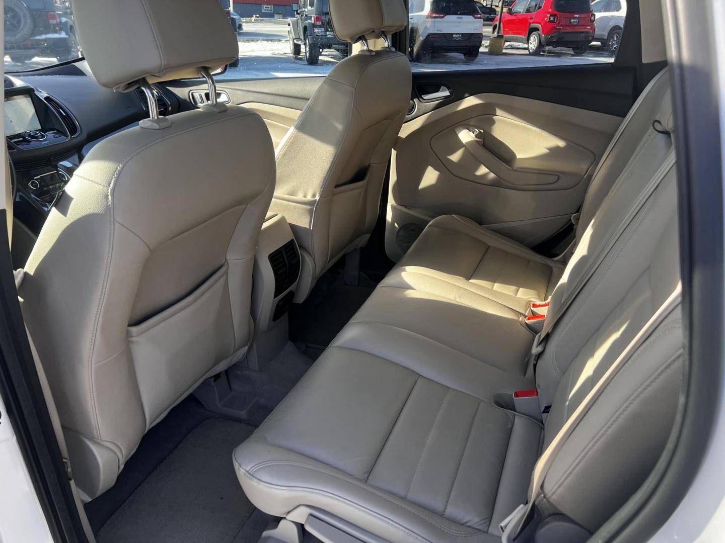 2016 White /Gray Ford Escape Titanium 4WD (1FMCU9J93GU) with an 2.0L I4 DOHC 16V Turbo engine, 6-Speed Automatic transmission, located at 547 E. Main St., Orwell, OH, 44076, (440) 437-5893, 41.535435, -80.847855 - Photo#34