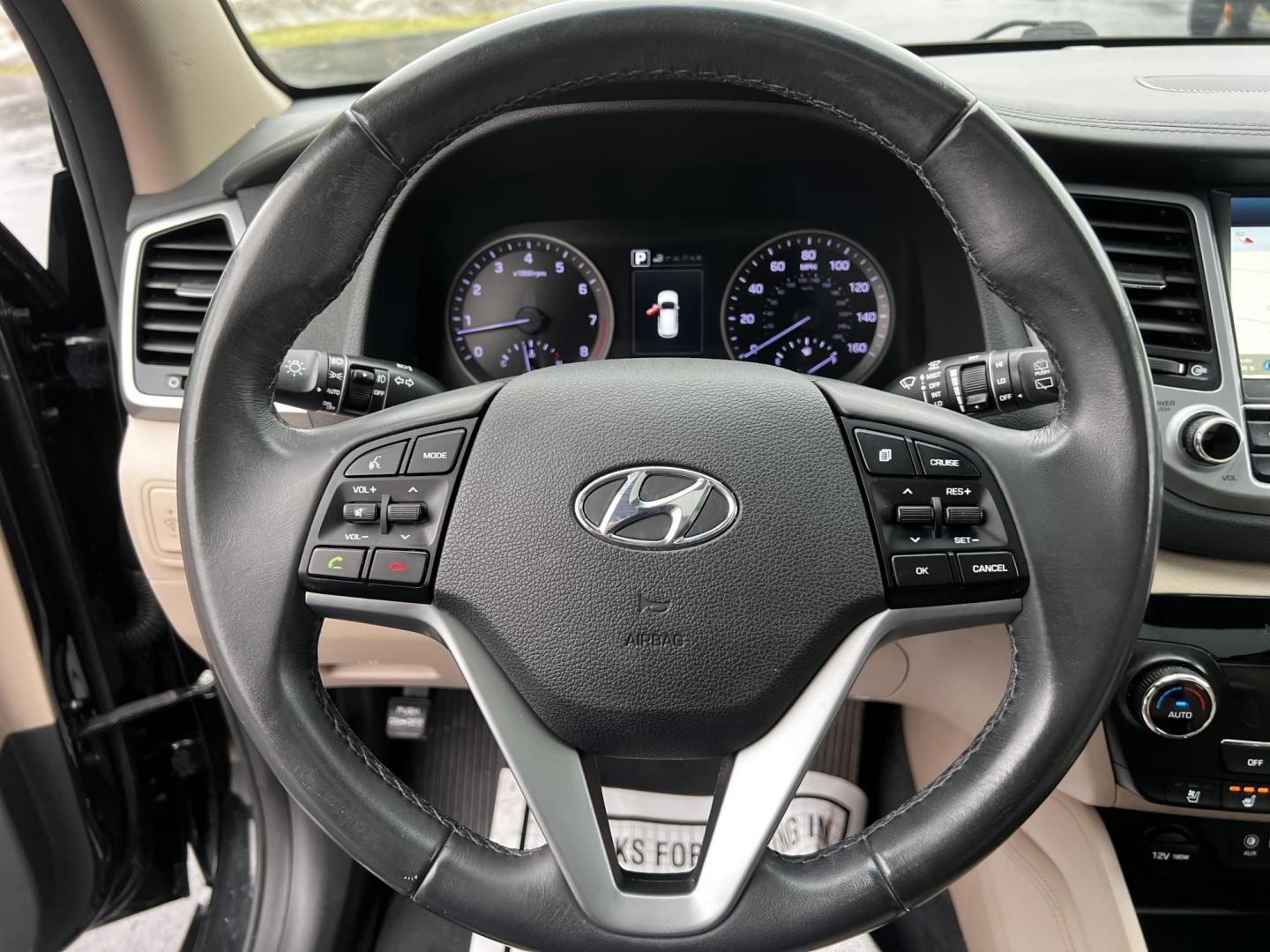 2016 Black /Black Hyundai Tucson Limited Ultimate AWD (KM8J3CA23GU) with an 1.6L I4 DOHC 16V TURBO engine, 7A transmission, located at 547 E. Main St., Orwell, OH, 44076, (440) 437-5893, 41.535435, -80.847855 - This One Owner 2016 Hyundai Tucson Limited Ultimate AWD is a compact SUV offering a blend of performance, luxury, and advanced technology. It features a 1.6-liter turbocharged I4 engine coupled with a 7-speed dual-clutch automatic transmission, providing a spirited driving experience. The interior b - Photo#21