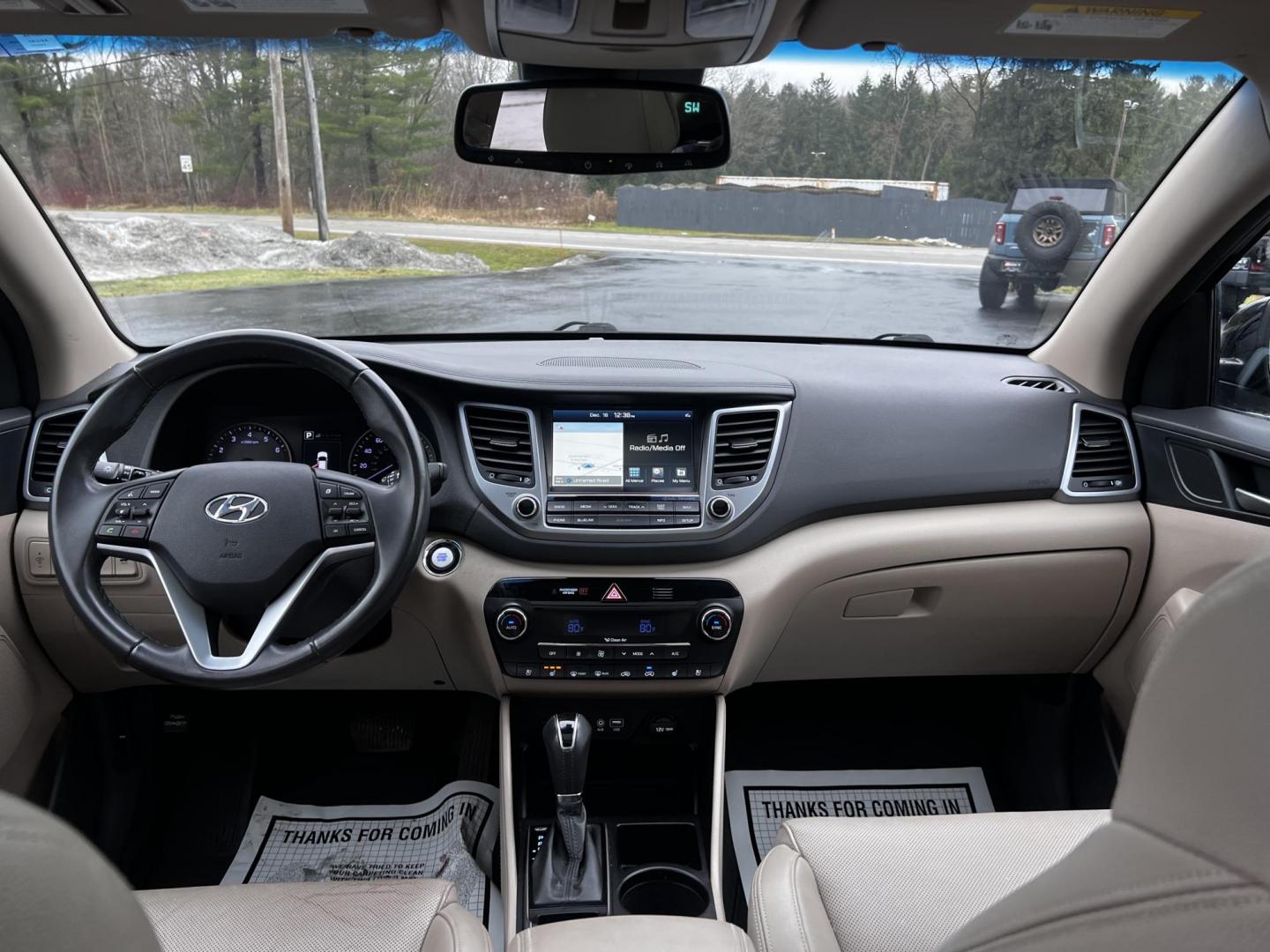 2016 Black /Black Hyundai Tucson Limited Ultimate AWD (KM8J3CA23GU) with an 1.6L I4 DOHC 16V TURBO engine, 7A transmission, located at 547 E. Main St., Orwell, OH, 44076, (440) 437-5893, 41.535435, -80.847855 - This One Owner 2016 Hyundai Tucson Limited Ultimate AWD is a compact SUV offering a blend of performance, luxury, and advanced technology. It features a 1.6-liter turbocharged I4 engine coupled with a 7-speed dual-clutch automatic transmission, providing a spirited driving experience. The interior b - Photo#34