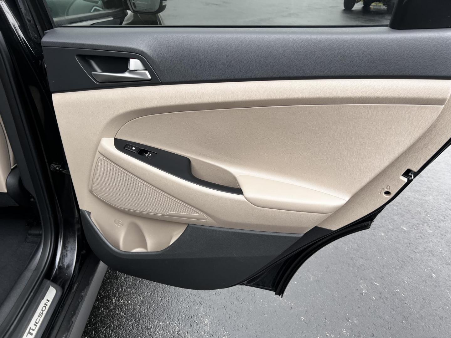 2016 Black /Black Hyundai Tucson Limited Ultimate AWD (KM8J3CA23GU) with an 1.6L I4 DOHC 16V TURBO engine, 7A transmission, located at 547 E. Main St., Orwell, OH, 44076, (440) 437-5893, 41.535435, -80.847855 - This One Owner 2016 Hyundai Tucson Limited Ultimate AWD is a compact SUV offering a blend of performance, luxury, and advanced technology. It features a 1.6-liter turbocharged I4 engine coupled with a 7-speed dual-clutch automatic transmission, providing a spirited driving experience. The interior b - Photo#41