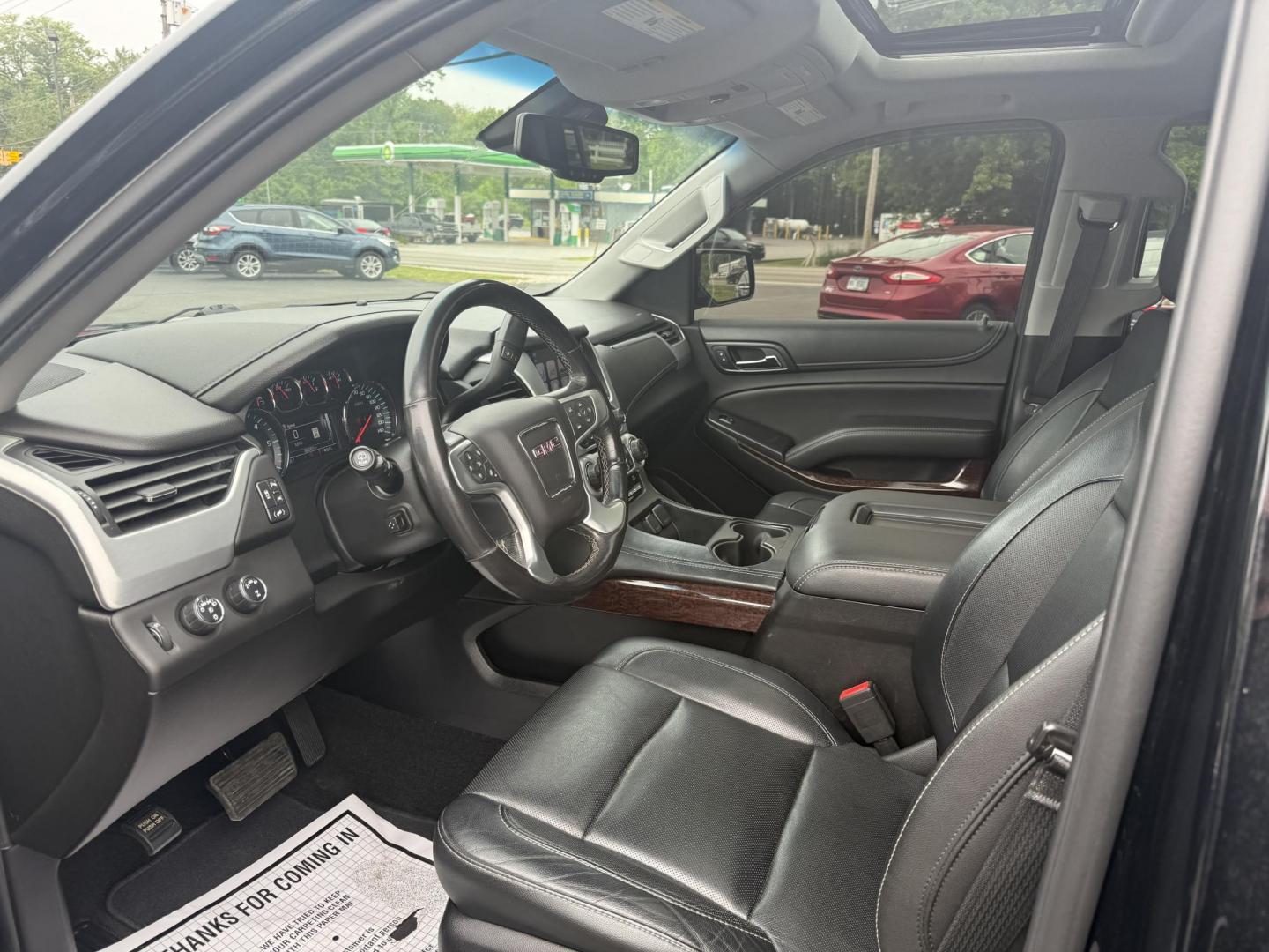 2018 Black /Black GMC Yukon SLT 4WD (1GKS2BKC4JR) with an 5.3L V8 OHV 16V engine, 6A transmission, located at 11115 Chardon Rd. , Chardon, OH, 44024, (440) 214-9705, 41.580246, -81.241943 - This 2018 GMC Yukon SLT 4WD is a full-size SUV that features a powerful 5.3-liter Vortec V8 engine and a 6-speed automatic transmission, boasting a towing capacity of 6,200 pounds, making it suitable for hauling and family adventures. Its luxurious interior includes leather seating with both heated - Photo#4