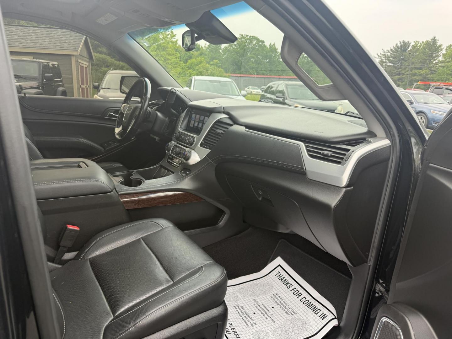 2018 Black /Black GMC Yukon SLT 4WD (1GKS2BKC4JR) with an 5.3L V8 OHV 16V engine, 6A transmission, located at 11115 Chardon Rd. , Chardon, OH, 44024, (440) 214-9705, 41.580246, -81.241943 - This 2018 GMC Yukon SLT 4WD is a full-size SUV that features a powerful 5.3-liter Vortec V8 engine and a 6-speed automatic transmission, boasting a towing capacity of 6,200 pounds, making it suitable for hauling and family adventures. Its luxurious interior includes leather seating with both heated - Photo#40