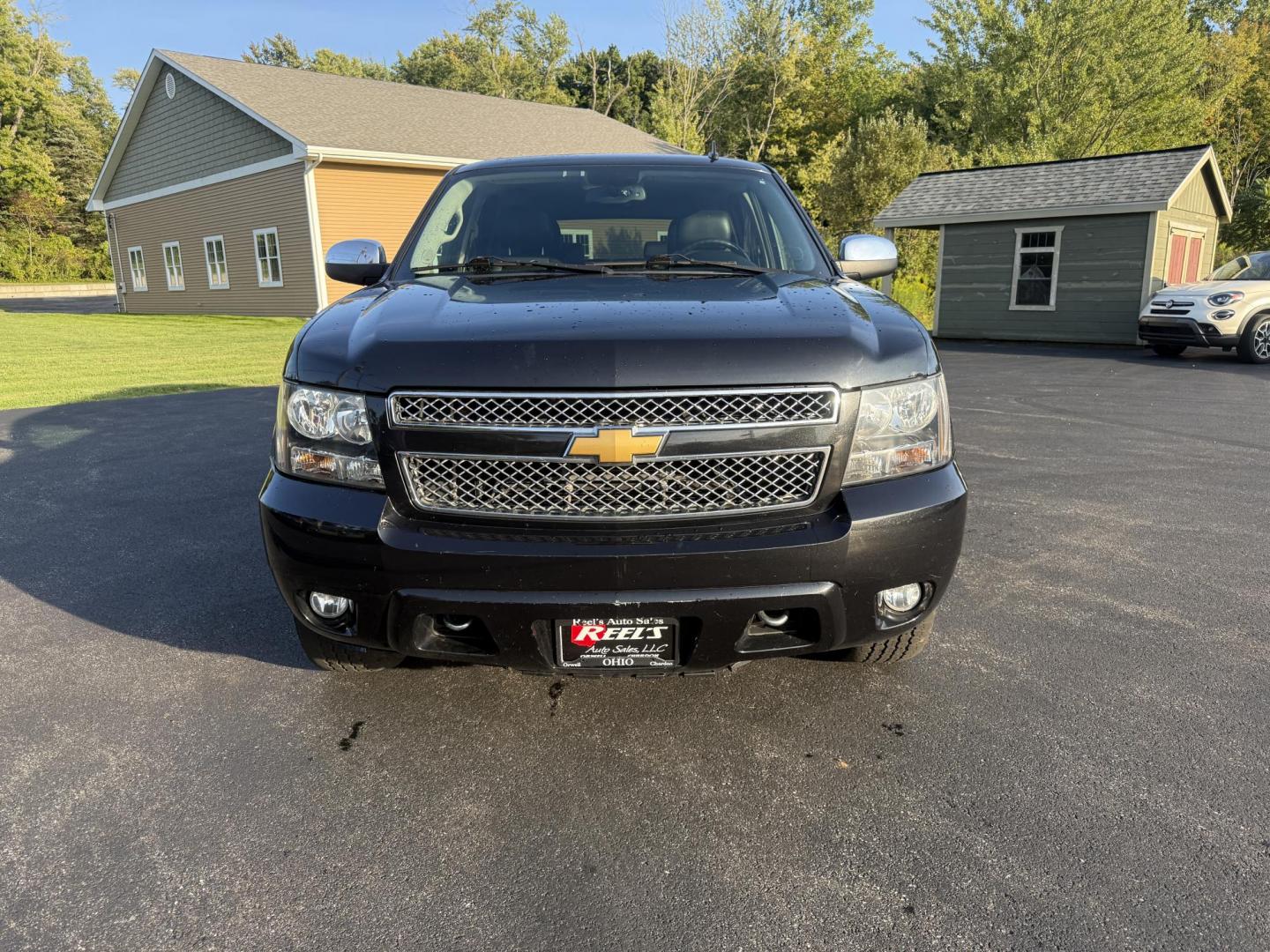 2013 Black /Black Chevrolet Tahoe LTZ 4WD (1GNSKCE02DR) with an 5.3L V8 OHV 16V FFV engine, 6-Speed Automatic transmission, located at 11115 Chardon Rd. , Chardon, OH, 44024, (440) 214-9705, 41.580246, -81.241943 - This 2013 Chevrolet Tahoe LTZ 4WD is a full-size SUV equipped with a 5.3-liter Vortec V8 engine and a 6-speed automatic transmission, as well as 3.42 gearing, which contributes to its impressive 8,200-pound towing capacity. Its interior is designed with luxury and comfort in mind, featuring leather - Photo#1