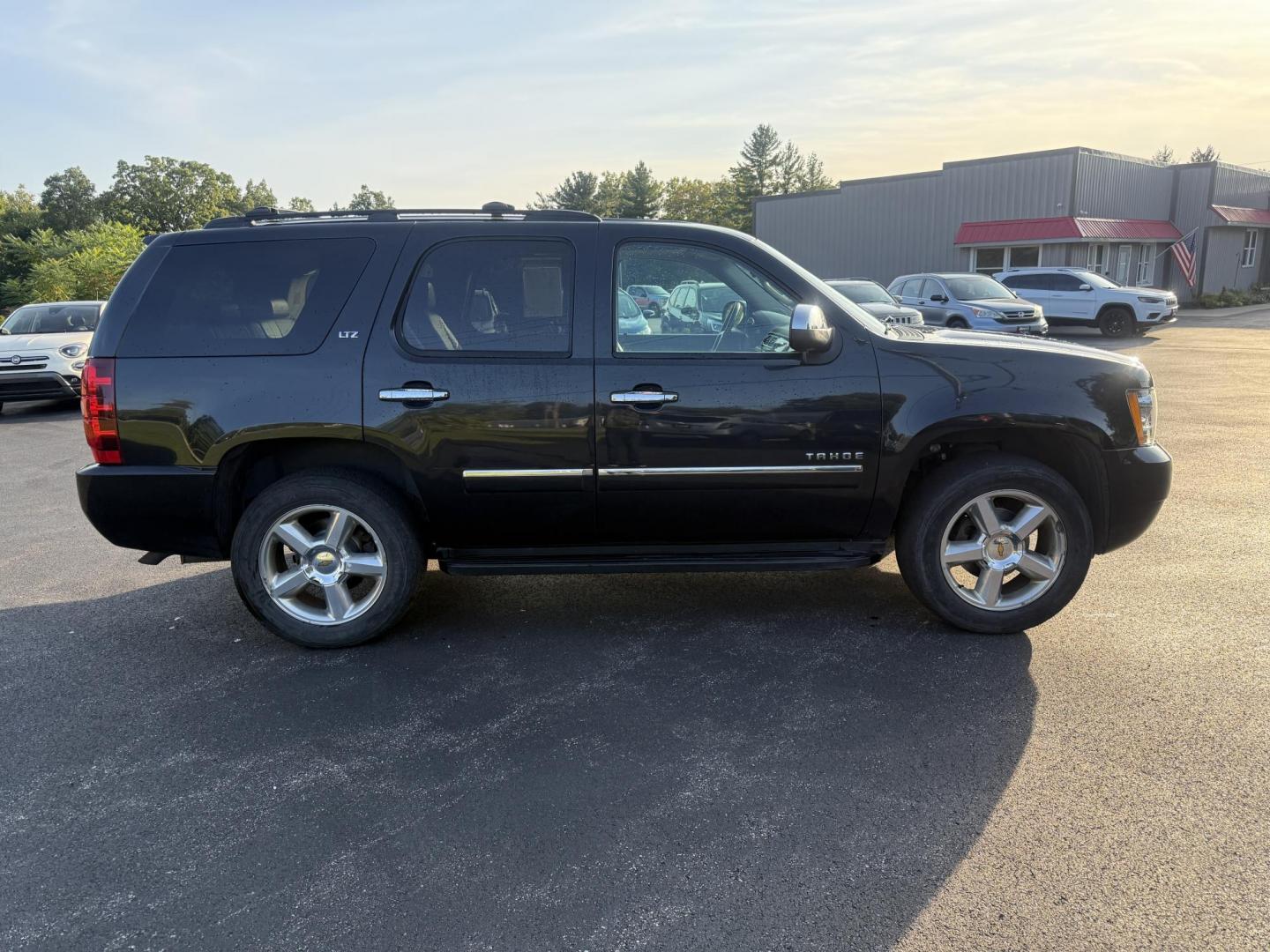 2013 Black /Black Chevrolet Tahoe LTZ 4WD (1GNSKCE02DR) with an 5.3L V8 OHV 16V FFV engine, 6-Speed Automatic transmission, located at 11115 Chardon Rd. , Chardon, OH, 44024, (440) 214-9705, 41.580246, -81.241943 - This 2013 Chevrolet Tahoe LTZ 4WD is a full-size SUV equipped with a 5.3-liter Vortec V8 engine and a 6-speed automatic transmission, as well as 3.42 gearing, which contributes to its impressive 8,200-pound towing capacity. Its interior is designed with luxury and comfort in mind, featuring leather - Photo#5