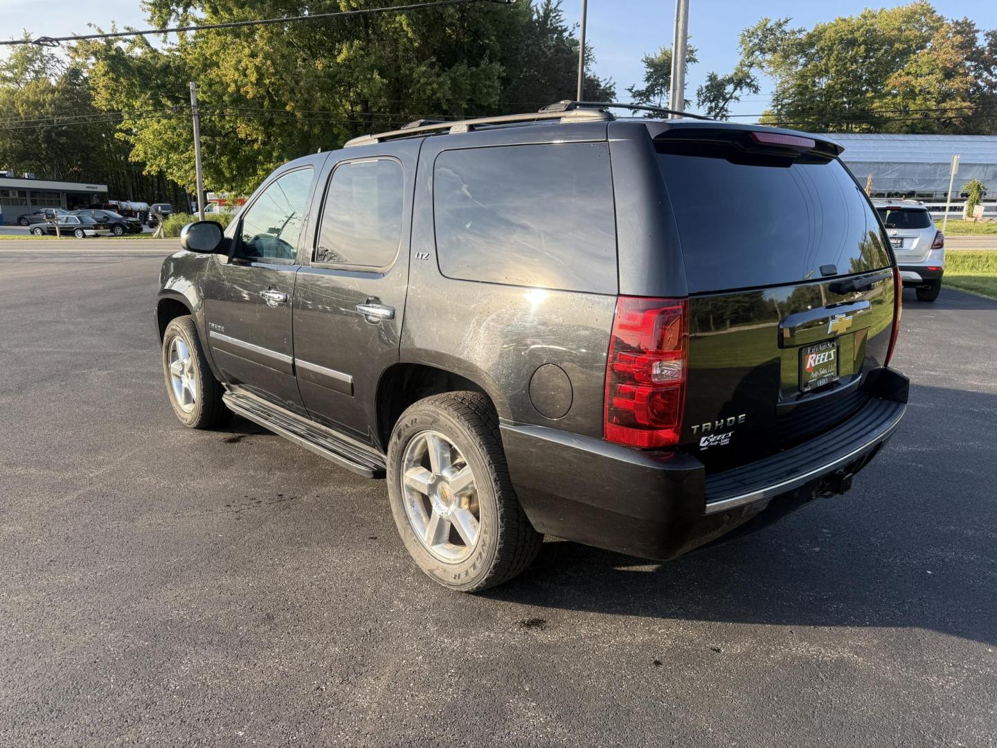 2013 Black /Black Chevrolet Tahoe LTZ 4WD (1GNSKCE02DR) with an 5.3L V8 OHV 16V FFV engine, 6-Speed Automatic transmission, located at 11115 Chardon Rd. , Chardon, OH, 44024, (440) 214-9705, 41.580246, -81.241943 - This 2013 Chevrolet Tahoe LTZ 4WD is a full-size SUV equipped with a 5.3-liter Vortec V8 engine and a 6-speed automatic transmission, as well as 3.42 gearing, which contributes to its impressive 8,200-pound towing capacity. Its interior is designed with luxury and comfort in mind, featuring leather - Photo#9