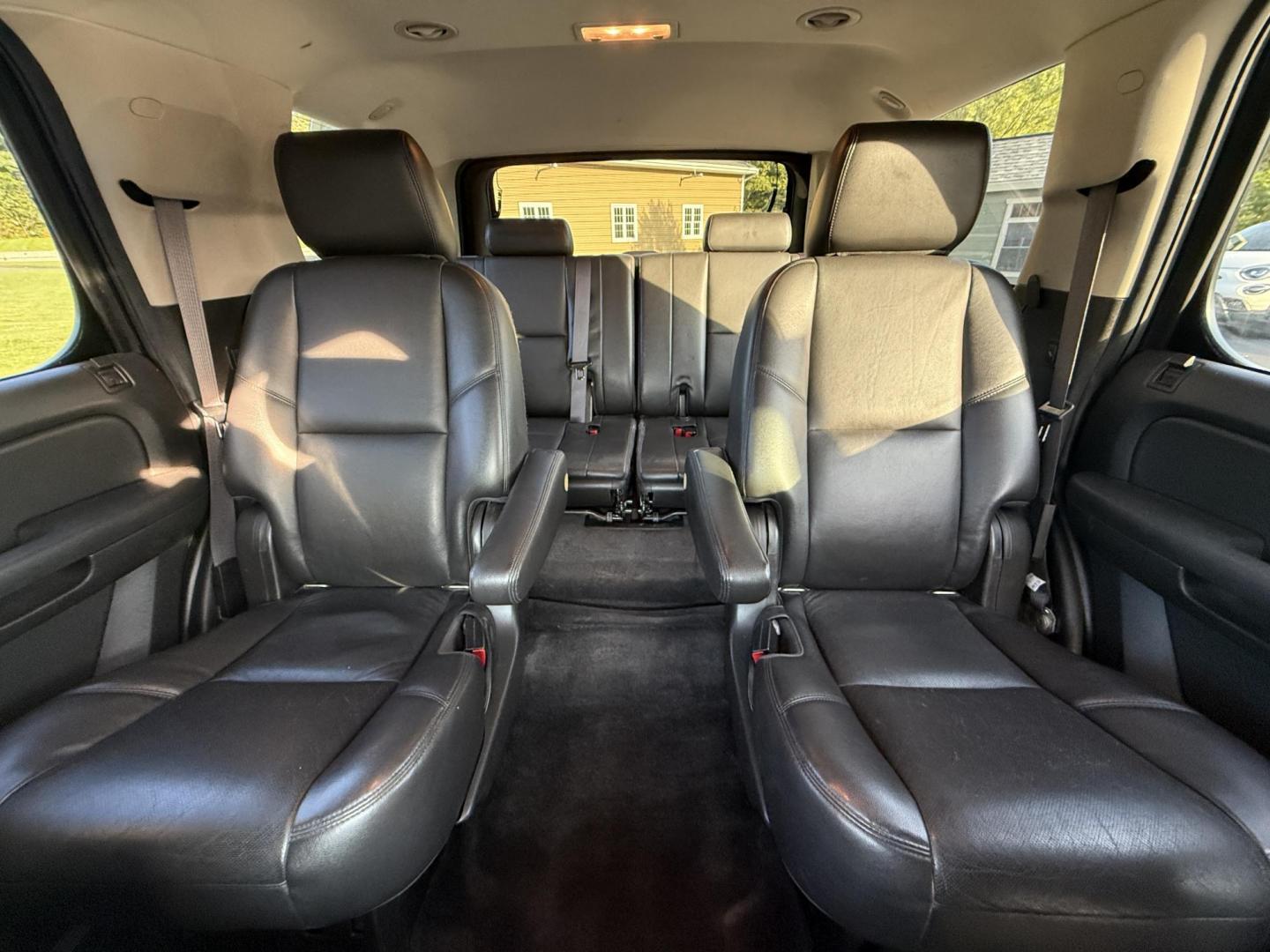 2013 Black /Black Chevrolet Tahoe LTZ 4WD (1GNSKCE02DR) with an 5.3L V8 OHV 16V FFV engine, 6-Speed Automatic transmission, located at 11115 Chardon Rd. , Chardon, OH, 44024, (440) 214-9705, 41.580246, -81.241943 - This 2013 Chevrolet Tahoe LTZ 4WD is a full-size SUV equipped with a 5.3-liter Vortec V8 engine and a 6-speed automatic transmission, as well as 3.42 gearing, which contributes to its impressive 8,200-pound towing capacity. Its interior is designed with luxury and comfort in mind, featuring leather - Photo#31