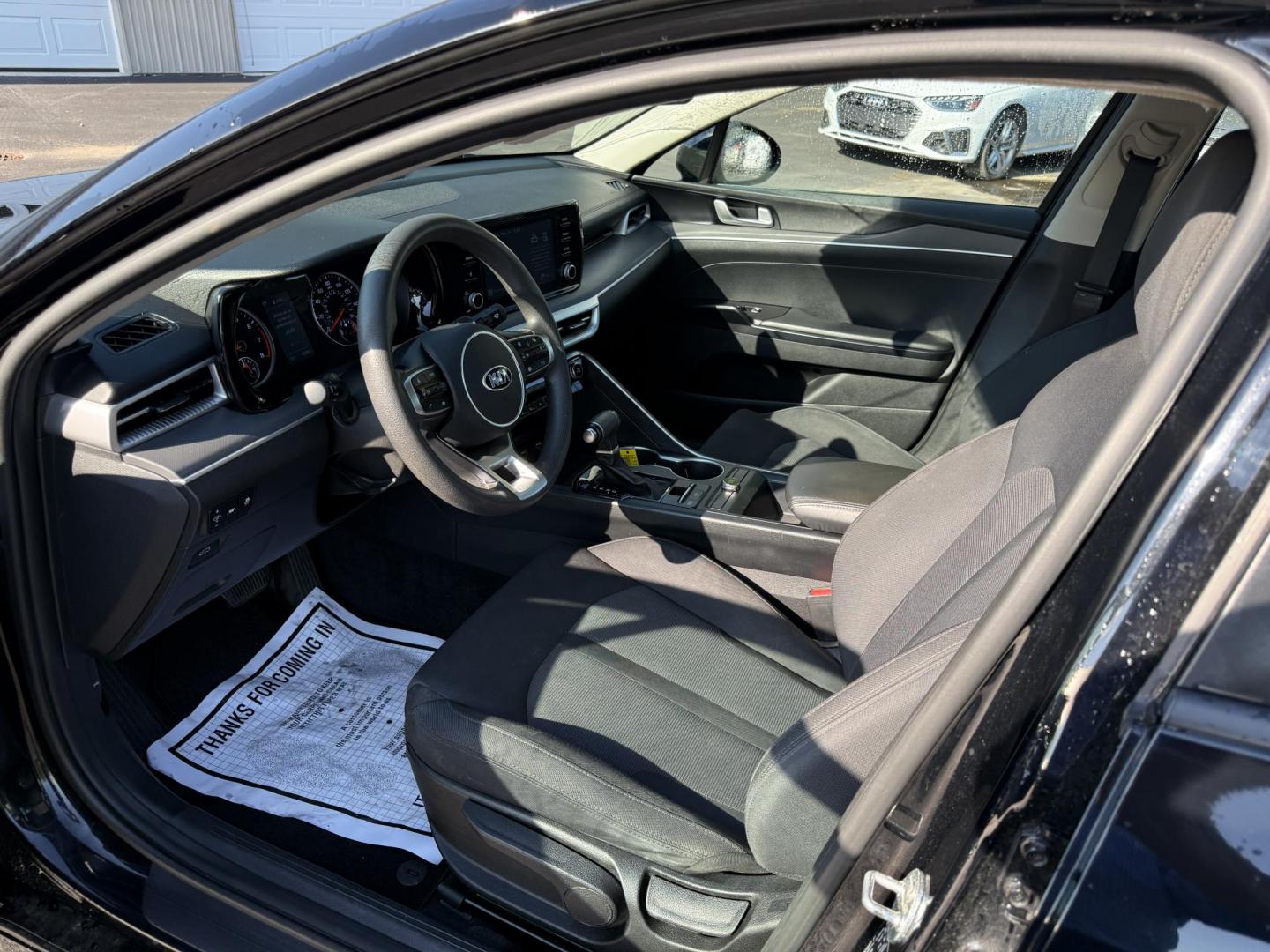 2021 Black /Black Kia K5 LXS (5XXG14J2XMG) with an 1.6L I4 DOHC 16V TURBO engine, 8-Speed Automatic transmission, located at 547 E. Main St., Orwell, OH, 44076, (440) 437-5893, 41.535435, -80.847855 - This 2021 Kia K5 LXS is a midsize sedan that combines style with a range of advanced features. It is powered by a 1.6-liter Turbocharged Inline-4 GDI engine paired with an 8-speed automatic transmission, delivering impressive fuel efficiency of 37 MPG on the highway. This vehicle comes equipped with - Photo#4
