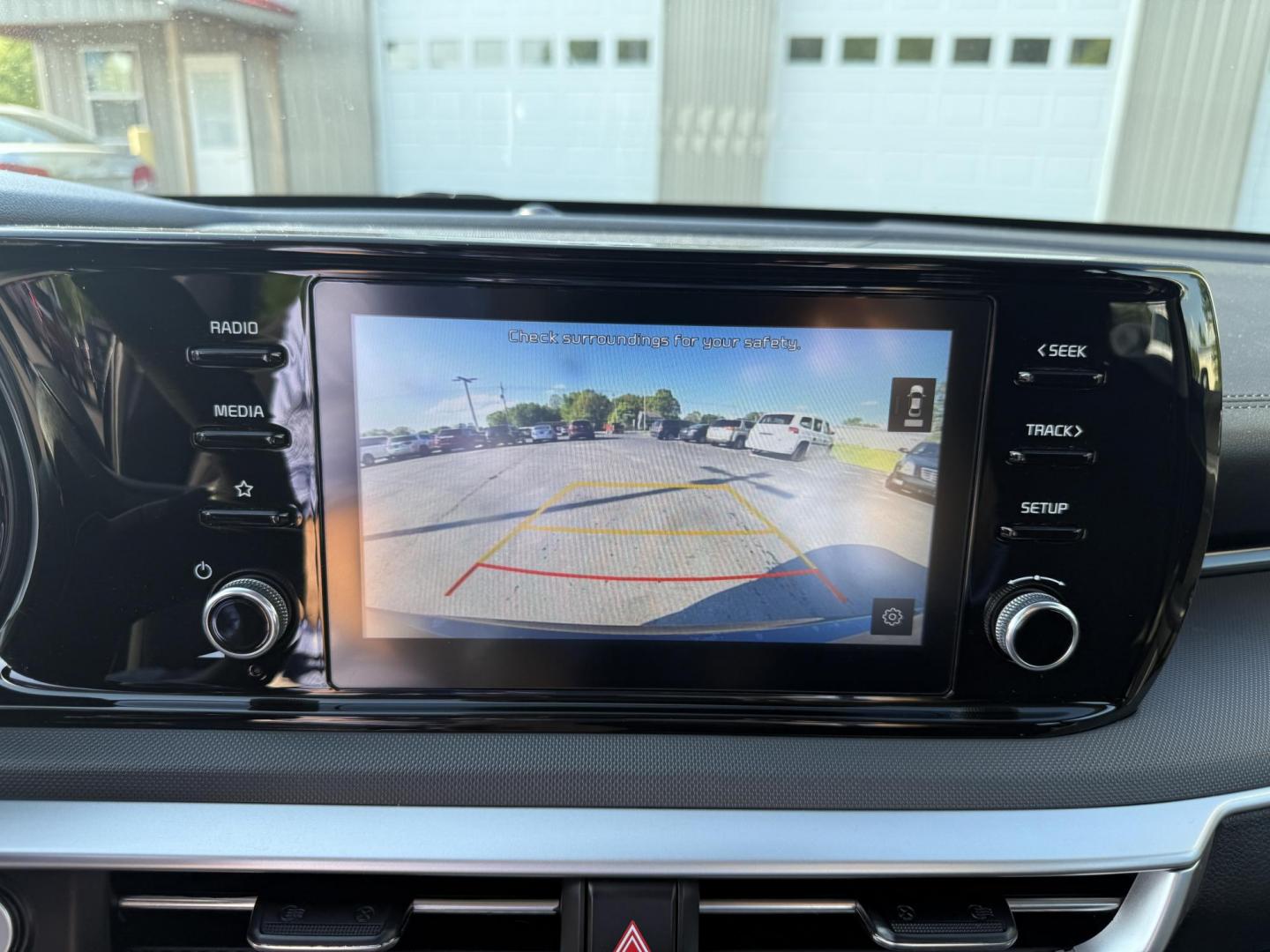 2021 Black /Black Kia K5 LXS (5XXG14J2XMG) with an 1.6L I4 DOHC 16V TURBO engine, 8-Speed Automatic transmission, located at 547 E. Main St., Orwell, OH, 44076, (440) 437-5893, 41.535435, -80.847855 - This 2021 Kia K5 LXS is a midsize sedan that combines style with a range of advanced features. It is powered by a 1.6-liter Turbocharged Inline-4 GDI engine paired with an 8-speed automatic transmission, delivering impressive fuel efficiency of 37 MPG on the highway. This vehicle comes equipped with - Photo#6