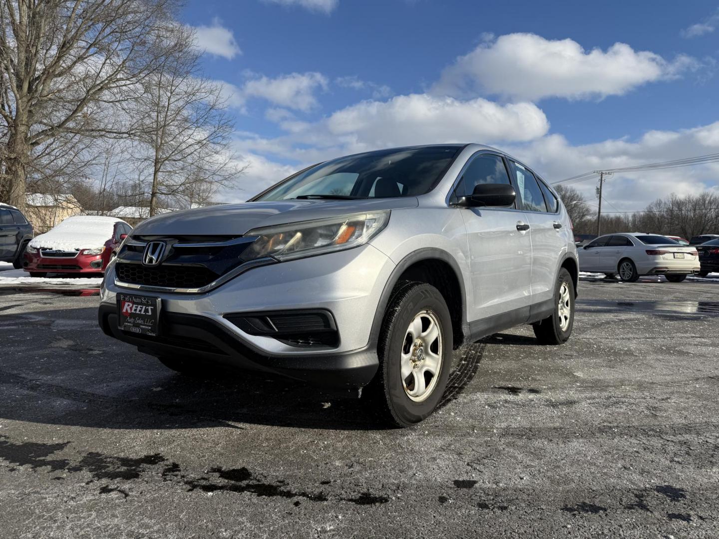 2015 Silver /Gray Honda CR-V LX 4WD (5J6RM4H39FL) with an 2.4L I4 DOHC 16V engine, Automatic transmission, located at 547 E. Main St., Orwell, OH, 44076, (440) 437-5893, 41.535435, -80.847855 - Photo#0