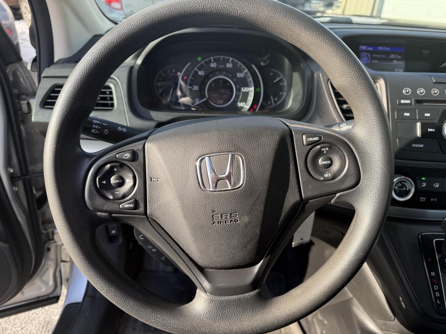2015 Silver /Gray Honda CR-V LX 4WD (5J6RM4H39FL) with an 2.4L I4 DOHC 16V engine, Automatic transmission, located at 547 E. Main St., Orwell, OH, 44076, (440) 437-5893, 41.535435, -80.847855 - Photo#22