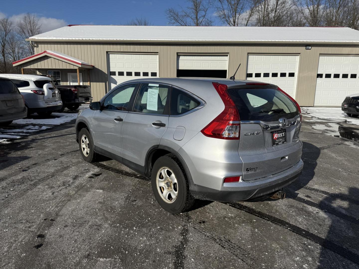 2015 Silver /Gray Honda CR-V LX 4WD (5J6RM4H39FL) with an 2.4L I4 DOHC 16V engine, Automatic transmission, located at 547 E. Main St., Orwell, OH, 44076, (440) 437-5893, 41.535435, -80.847855 - Photo#9