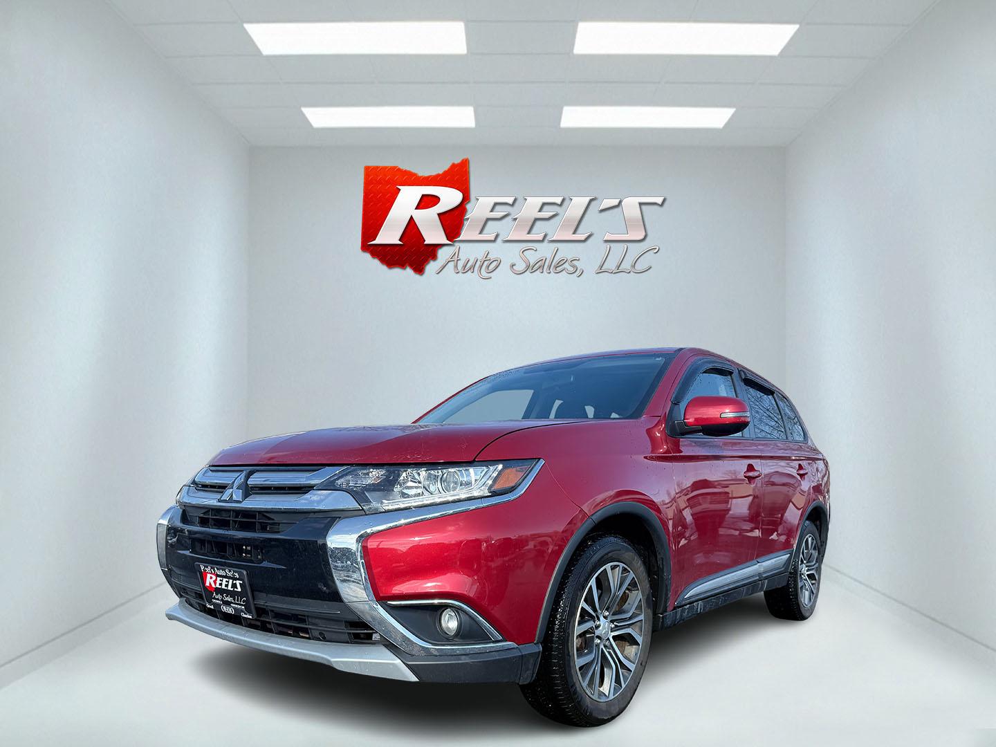 2018 Red /Black Mitsubishi Outlander SE AWD (JA4AZ3A32JZ) with an 2.4L I4 DOHC 16V engine, Automatic transmission, located at 11115 Chardon Rd. , Chardon, OH, 44024, (440) 214-9705, 41.580246, -81.241943 - This 2018 Mitsubishi Outlander SE AWD is a versatile SUV equipped with a 2.4-liter I4 engine and CVT transmission, providing a balanced combination of power and fuel efficiency, with an estimated 29 MPG on the highway. It features LED daytime running lights and a backup camera for enhanced safety an - Photo#0