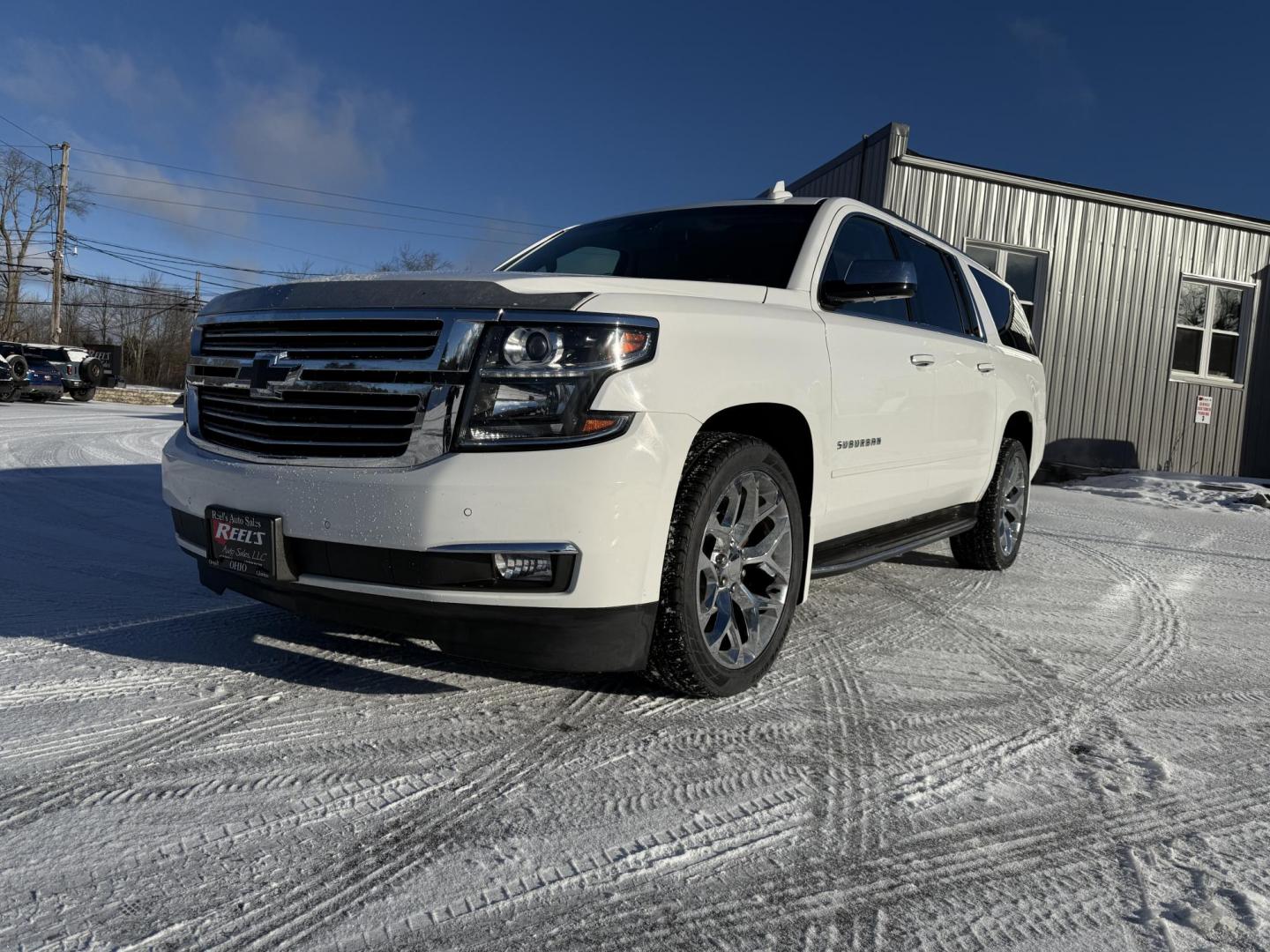 2017 White /Brown Chevrolet Suburban Premier 4WD (1GNSKJKC0HR) with an 5.3L V8 OHV 16V engine, 6A transmission, located at 11115 Chardon Rd. , Chardon, OH, 44024, (440) 214-9705, 41.580246, -81.241943 - This 2017 Chevrolet Suburban Premier 4WD is a spacious and well-equipped full-size SUV, powered by a 5.3-liter Vortec V8 engine paired with a 6-speed automatic transmission. It offers a luxurious leather interior with modern conveniences like heated and cooled front seats, heated rear seats, and adv - Photo#0
