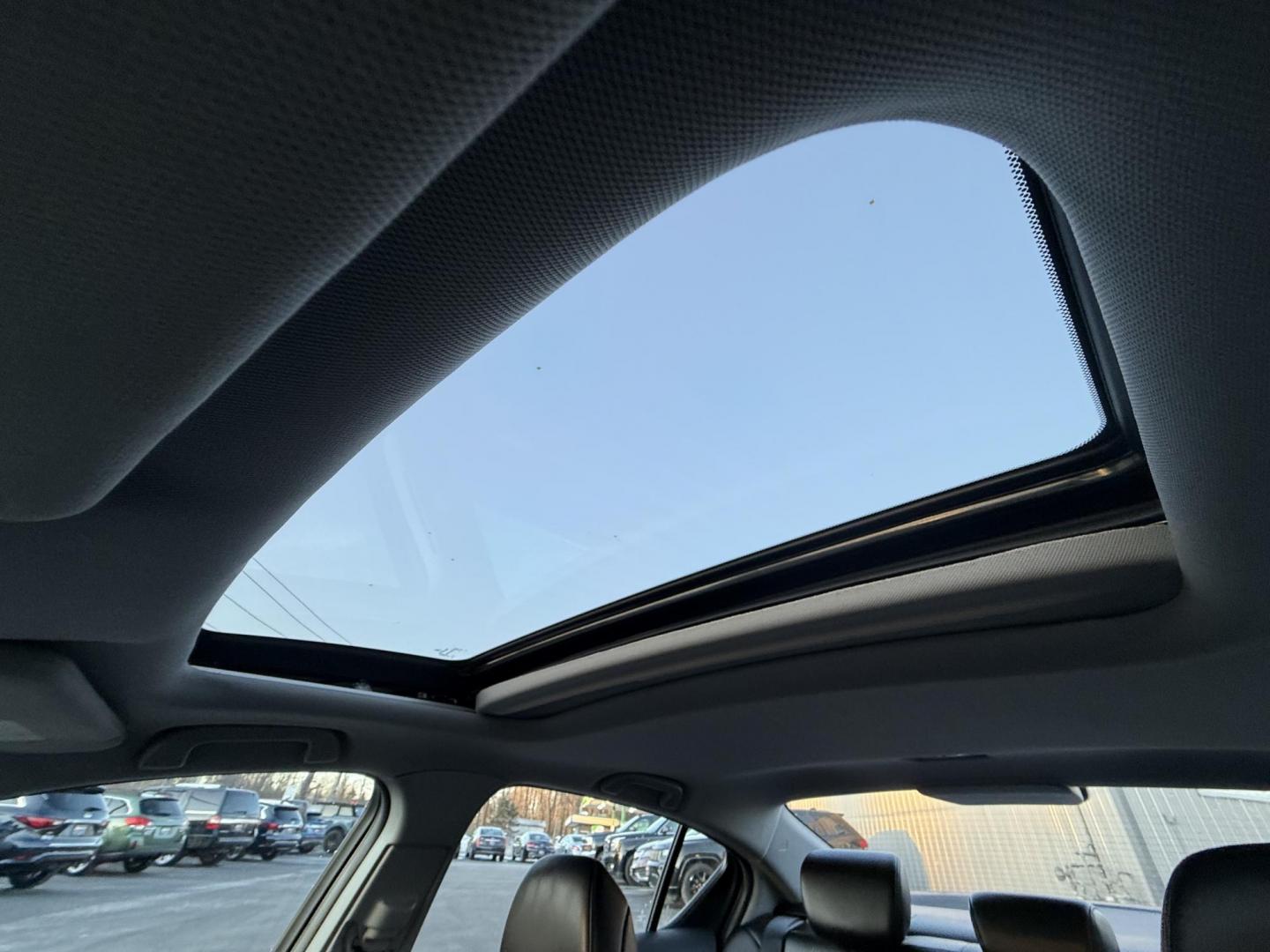 2021 White /Black Acura ILX Base (19UDE2F36MA) with an 2.0L I4 16V DOHC engine, 8A transmission, located at 547 E. Main St., Orwell, OH, 44076, (440) 437-5893, 41.535435, -80.847855 - This 2021 Acura ILX, equipped with a 2.4-liter Earthdreams I4 engine and an 8-speed automatic transmission, delivers a refined driving experience with efficient performance, achieving up to 34 MPG on the highway. The leather interior with heated front seats offers a touch of luxury, while features l - Photo#9