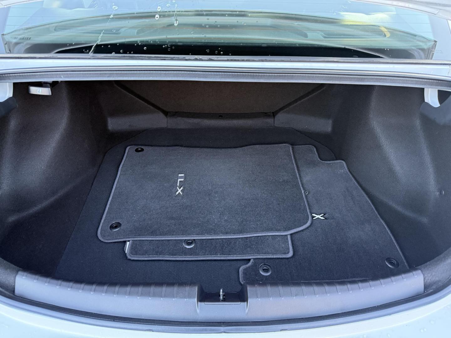 2021 White /Black Acura ILX Base (19UDE2F36MA) with an 2.0L I4 16V DOHC engine, 8A transmission, located at 547 E. Main St., Orwell, OH, 44076, (440) 437-5893, 41.535435, -80.847855 - This 2021 Acura ILX, equipped with a 2.4-liter Earthdreams I4 engine and an 8-speed automatic transmission, delivers a refined driving experience with efficient performance, achieving up to 34 MPG on the highway. The leather interior with heated front seats offers a touch of luxury, while features l - Photo#33