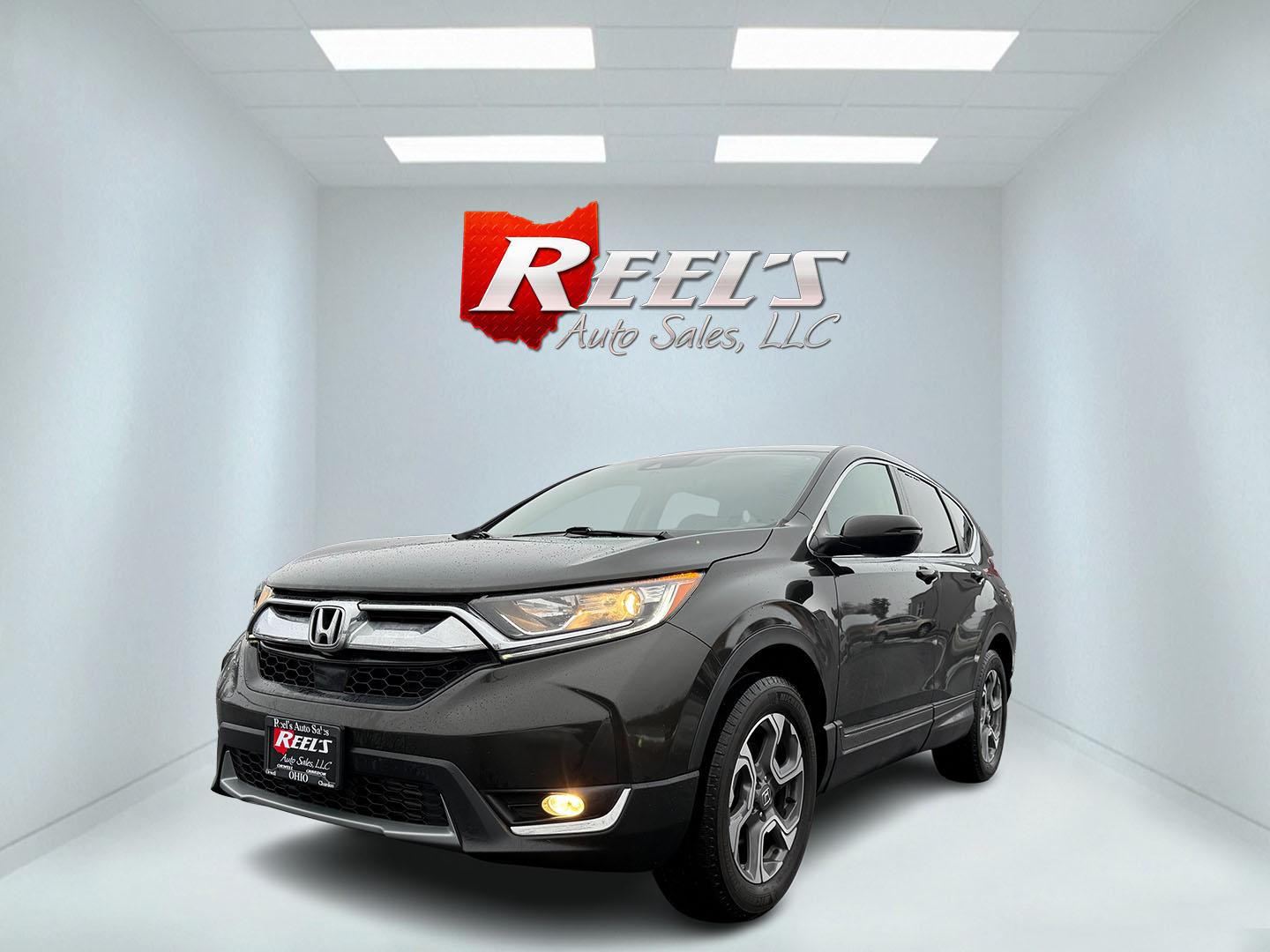 2018 Gray /Black Honda CR-V EX AWD (7FARW2H58JE) with an 1.5L I4 DOHC 16V TURBO engine, Automatic transmission, located at 11115 Chardon Rd. , Chardon, OH, 44024, (440) 214-9705, 41.580246, -81.241943 - This One Owner 2018 Honda CR-V EX AWD offers a 1.5-liter Turbocharged Earthdreams I4 engine with an impressive 33 MPG on the highway. It is equipped with modern amenities such as LED headlights, heated front seats, a power-adjustable driver's seat, and connectivity features like Apple CarPlay and An - Photo#0