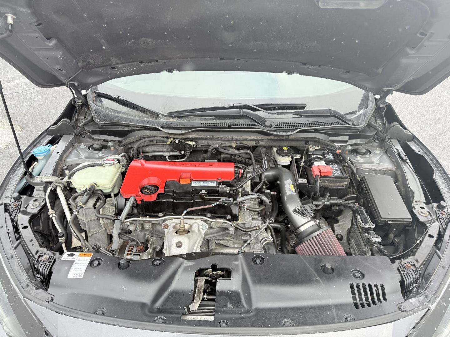 2018 Gray /Black Honda Civic LX Coupe CVT (2HGFC4B51JH) with an 2.0L I4 DOHC 16V engine, Automatic transmission, located at 547 E. Main St., Orwell, OH, 44076, (440) 437-5893, 41.535435, -80.847855 - This 2018 Honda Civic LX Coupe boasts a fuel-efficient 2.0L I4 Earthdreams engine achieving 39 MPG on the highway, and comes well-equipped with modern conveniences like a backup camera and a 5.0-inch center screen, making it a practical and reliable choice. This Honda is fully serviced, comes with a - Photo#3