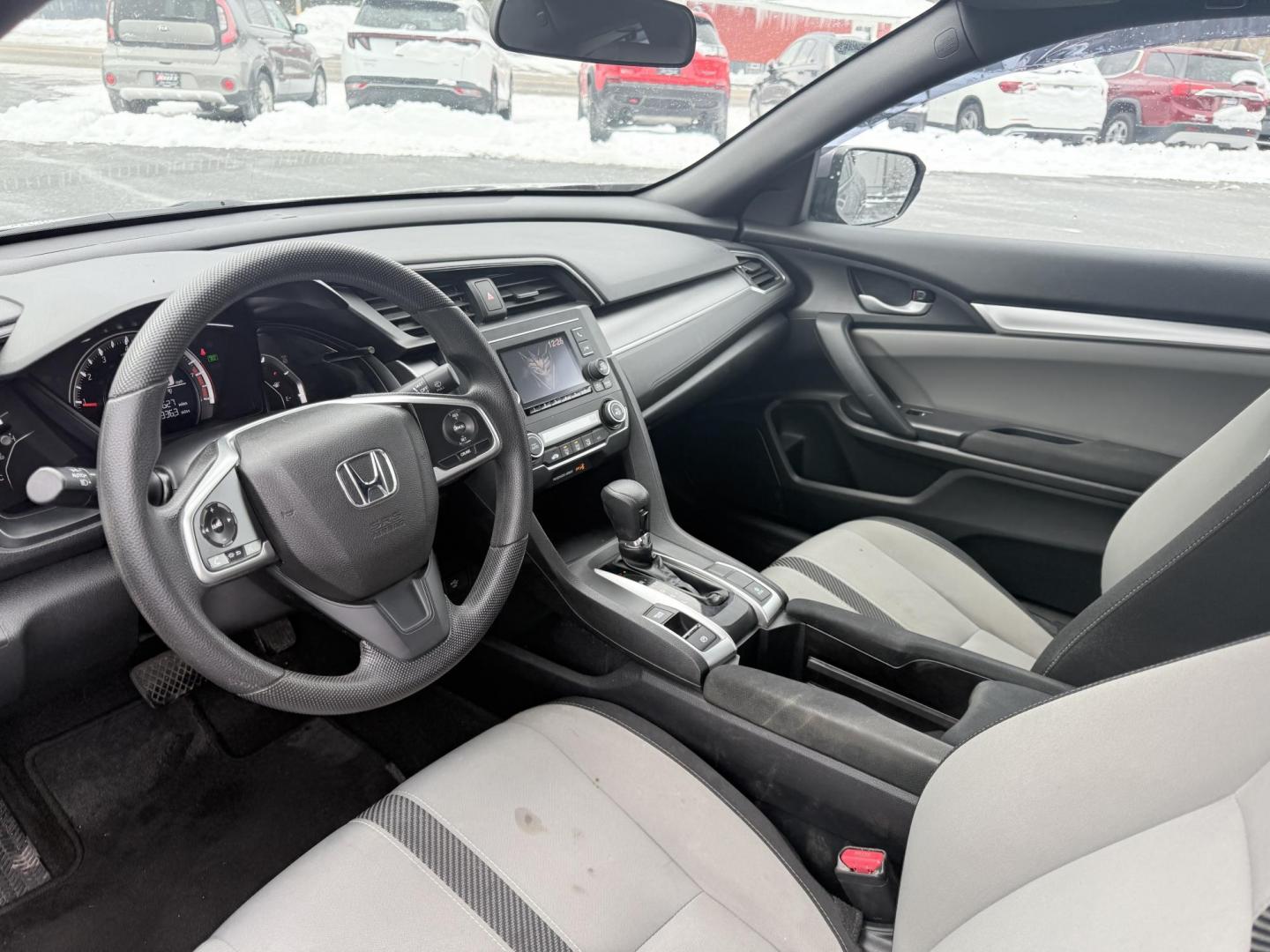 2018 Gray /Black Honda Civic LX Coupe CVT (2HGFC4B51JH) with an 2.0L I4 DOHC 16V engine, Automatic transmission, located at 547 E. Main St., Orwell, OH, 44076, (440) 437-5893, 41.535435, -80.847855 - This 2018 Honda Civic LX Coupe boasts a fuel-efficient 2.0L I4 Earthdreams engine achieving 39 MPG on the highway, and comes well-equipped with modern conveniences like a backup camera and a 5.0-inch center screen, making it a practical and reliable choice. This Honda is fully serviced, comes with a - Photo#4