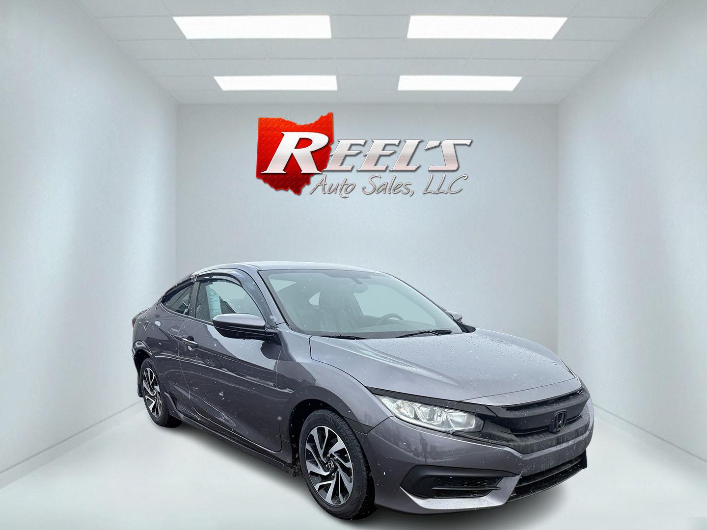 2018 Gray /Black Honda Civic LX Coupe CVT (2HGFC4B51JH) with an 2.0L I4 DOHC 16V engine, Automatic transmission, located at 547 E. Main St., Orwell, OH, 44076, (440) 437-5893, 41.535435, -80.847855 - This 2018 Honda Civic LX Coupe boasts a fuel-efficient 2.0L I4 Earthdreams engine achieving 39 MPG on the highway, and comes well-equipped with modern conveniences like a backup camera and a 5.0-inch center screen, making it a practical and reliable choice. This Honda is fully serviced, comes with a - Photo#2