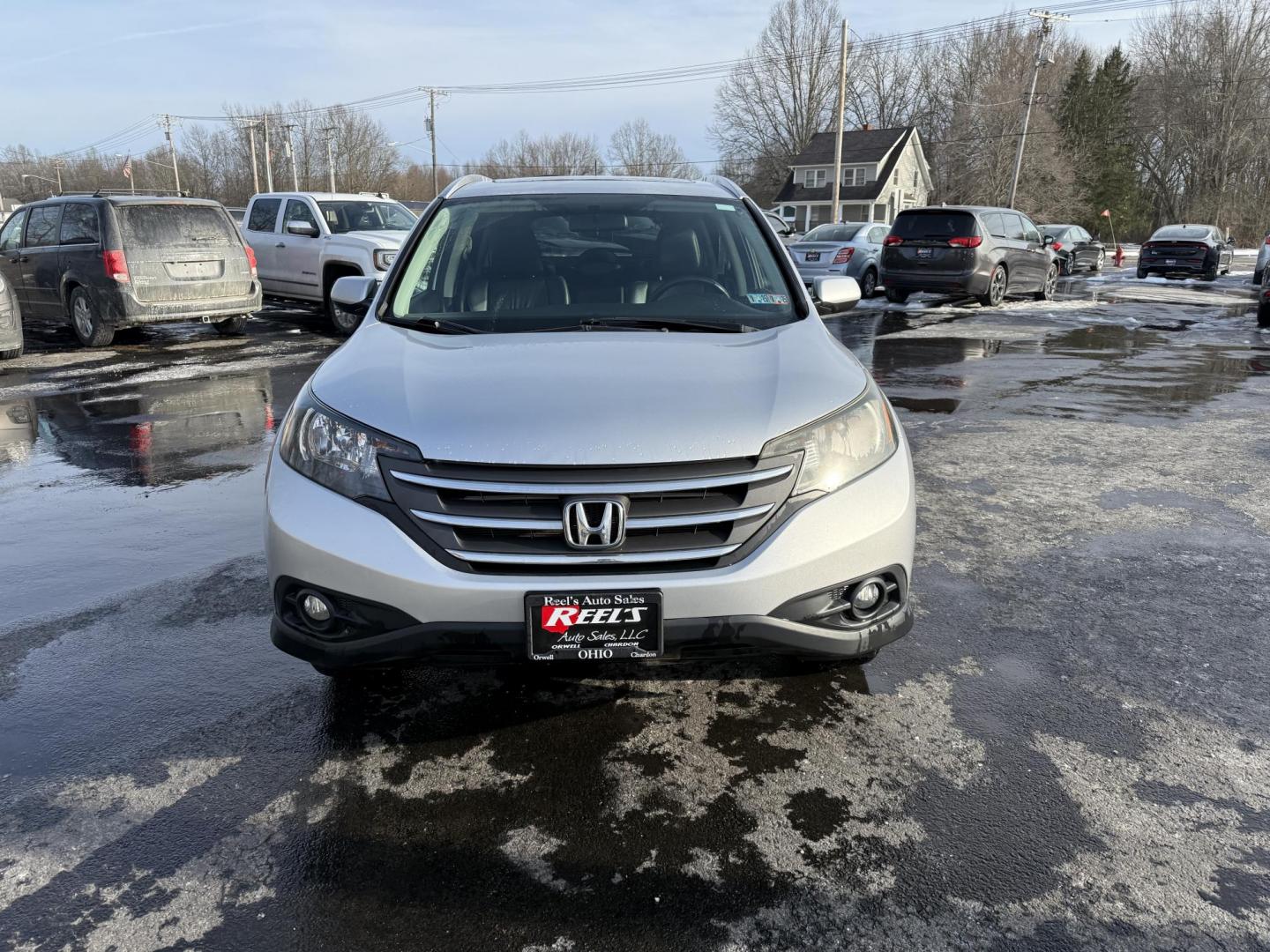 2013 Silver /Black Honda CR-V EX-L 4WD 5-Speed AT (2HKRM4H72DH) with an 2.4L I4 DOHC 16V engine, 5-Speed Automatic transmission, located at 547 E. Main St., Orwell, OH, 44076, (440) 437-5893, 41.535435, -80.847855 - This 2013 Honda CR-V EX-L AWD combines practicality with luxury amenities, making it an appealing option for those seeking comfort and performance. Powered by a 2.4-liter I4 engine paired with a 5-speed automatic transmission, it provides a reliable and smooth driving experience. This model features - Photo#1