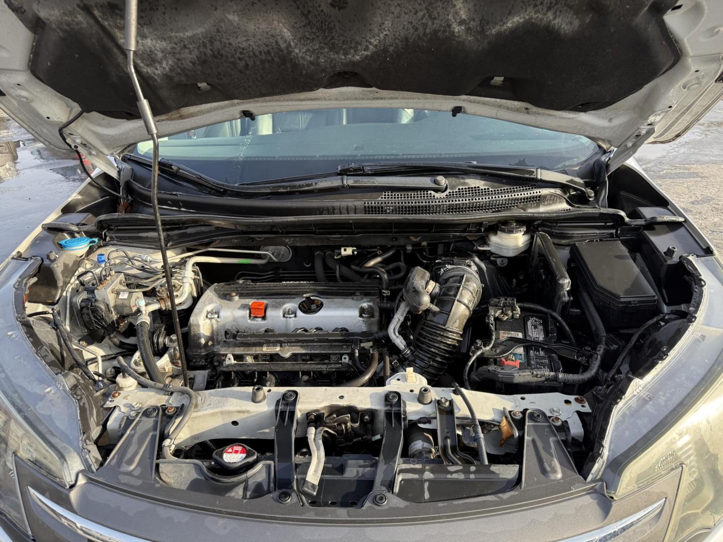 2013 Silver /Black Honda CR-V EX-L 4WD 5-Speed AT (2HKRM4H72DH) with an 2.4L I4 DOHC 16V engine, 5-Speed Automatic transmission, located at 547 E. Main St., Orwell, OH, 44076, (440) 437-5893, 41.535435, -80.847855 - This 2013 Honda CR-V EX-L AWD combines practicality with luxury amenities, making it an appealing option for those seeking comfort and performance. Powered by a 2.4-liter I4 engine paired with a 5-speed automatic transmission, it provides a reliable and smooth driving experience. This model features - Photo#14