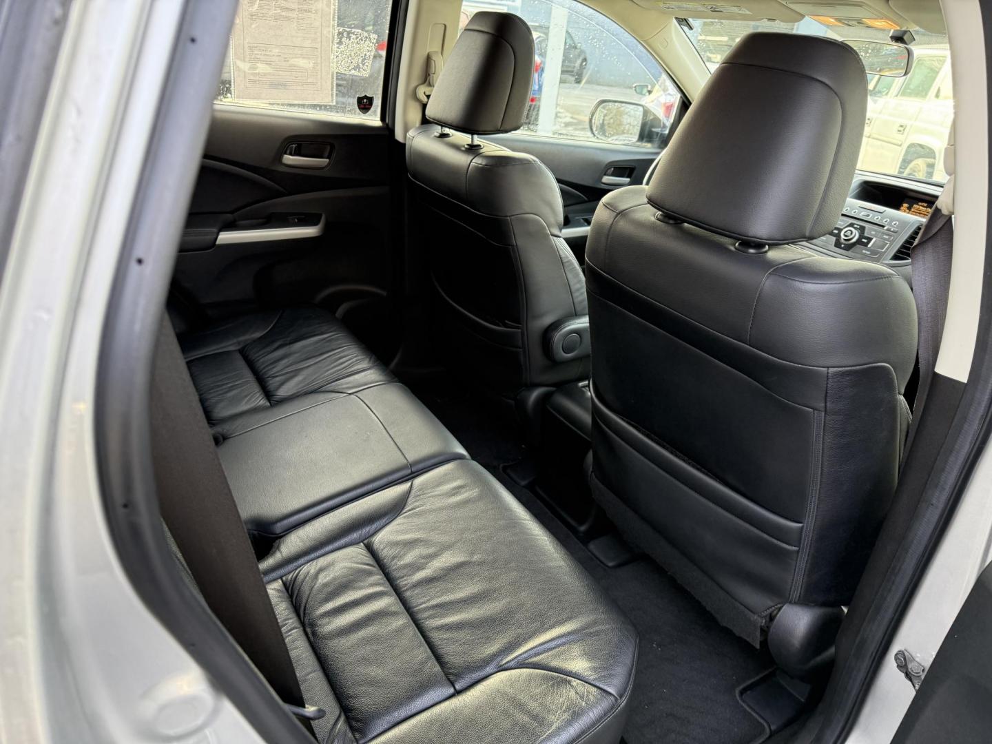 2013 Silver /Black Honda CR-V EX-L 4WD 5-Speed AT (2HKRM4H72DH) with an 2.4L I4 DOHC 16V engine, 5-Speed Automatic transmission, located at 547 E. Main St., Orwell, OH, 44076, (440) 437-5893, 41.535435, -80.847855 - This 2013 Honda CR-V EX-L AWD combines practicality with luxury amenities, making it an appealing option for those seeking comfort and performance. Powered by a 2.4-liter I4 engine paired with a 5-speed automatic transmission, it provides a reliable and smooth driving experience. This model features - Photo#35