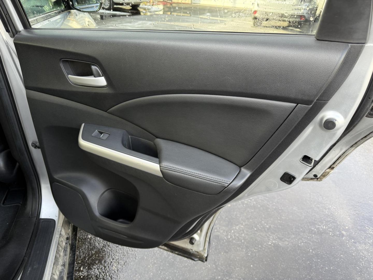 2013 Silver /Black Honda CR-V EX-L 4WD 5-Speed AT (2HKRM4H72DH) with an 2.4L I4 DOHC 16V engine, 5-Speed Automatic transmission, located at 547 E. Main St., Orwell, OH, 44076, (440) 437-5893, 41.535435, -80.847855 - This 2013 Honda CR-V EX-L AWD combines practicality with luxury amenities, making it an appealing option for those seeking comfort and performance. Powered by a 2.4-liter I4 engine paired with a 5-speed automatic transmission, it provides a reliable and smooth driving experience. This model features - Photo#36