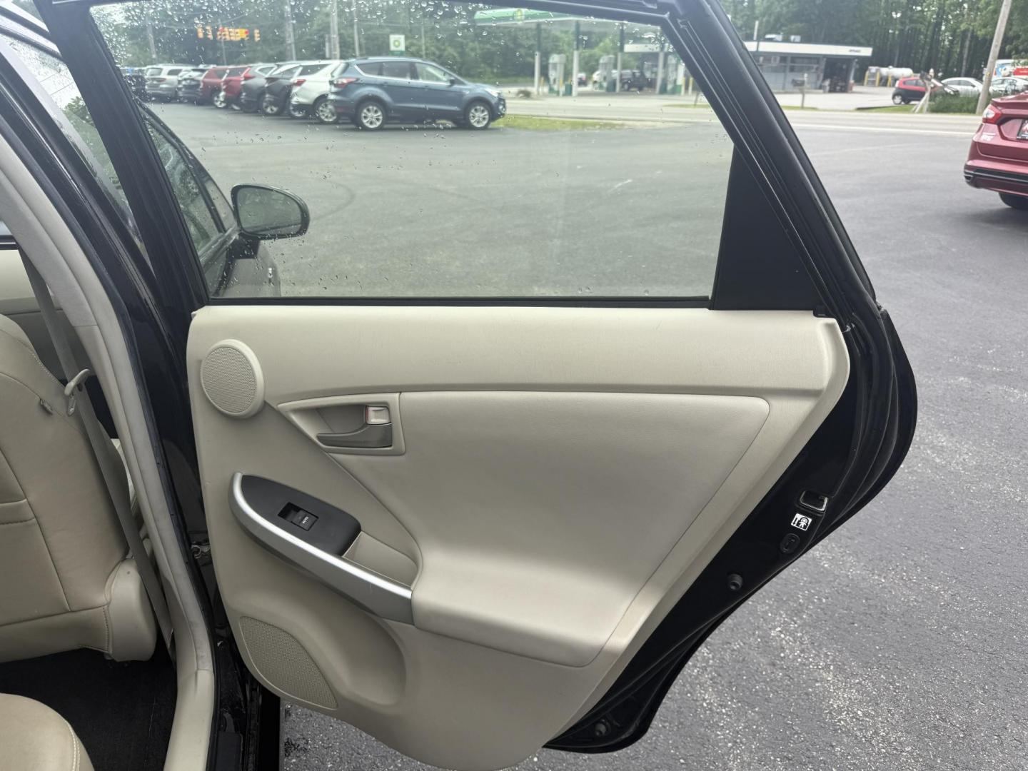 2015 Black /Brown Toyota Prius Four (JTDKN3DU9F1) with an 1.8L I4 DOHC 16V HYBRID engine, Automatic transmission, located at 11115 Chardon Rd. , Chardon, OH, 44024, (440) 214-9705, 41.580246, -81.241943 - This 2015 Toyota Prius Four is a desirable trim level for those seeking both efficiency and luxury features. It boasts a leather interior and heated front seats, providing comfort and a premium feel. The vehicle's technology includes a 6.1-inch touchscreen, which facilitates access to its navigation - Photo#28