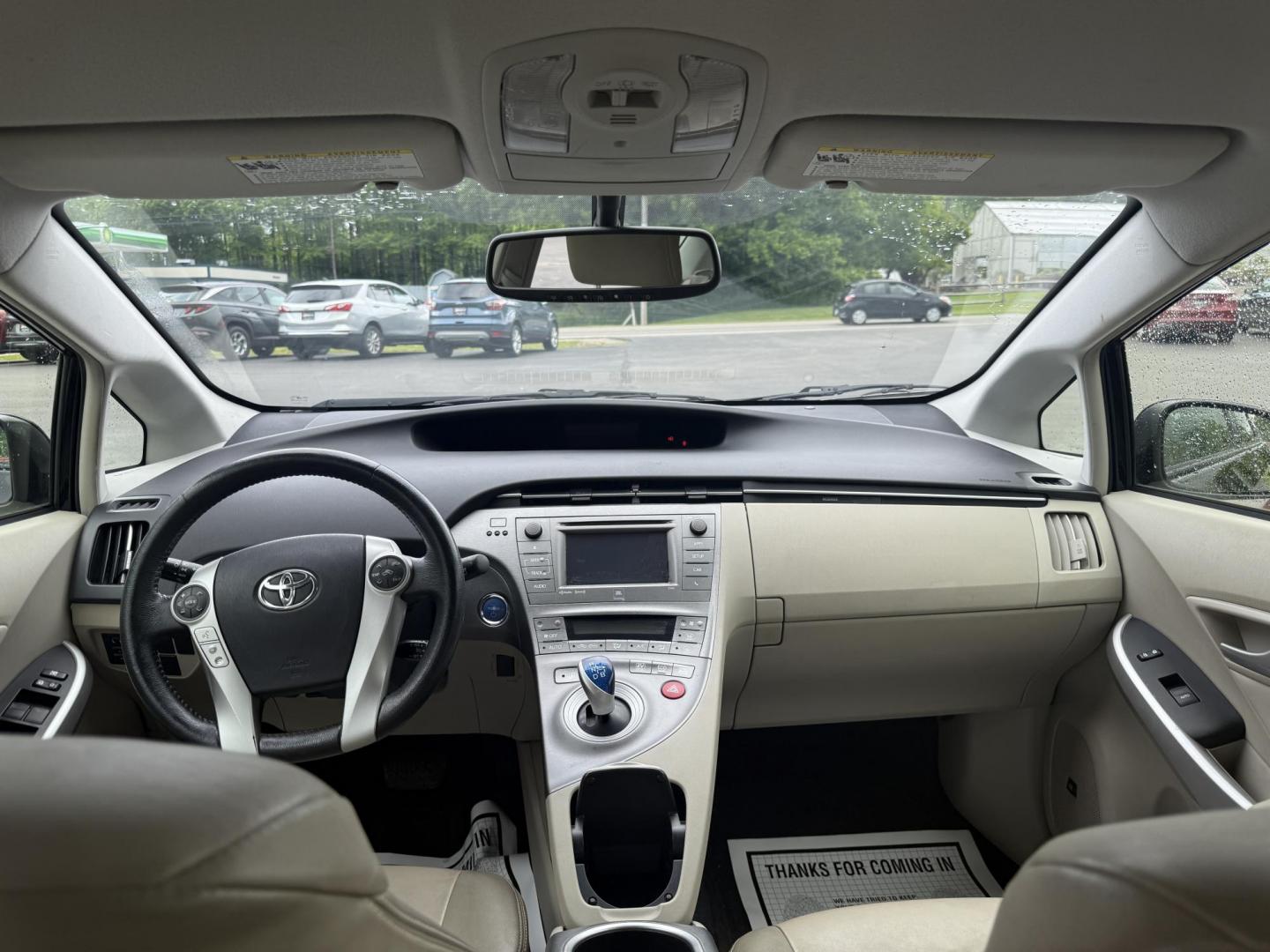2015 Black /Brown Toyota Prius Four (JTDKN3DU9F1) with an 1.8L I4 DOHC 16V HYBRID engine, Automatic transmission, located at 11115 Chardon Rd. , Chardon, OH, 44024, (440) 214-9705, 41.580246, -81.241943 - This 2015 Toyota Prius Four is a desirable trim level for those seeking both efficiency and luxury features. It boasts a leather interior and heated front seats, providing comfort and a premium feel. The vehicle's technology includes a 6.1-inch touchscreen, which facilitates access to its navigation - Photo#9