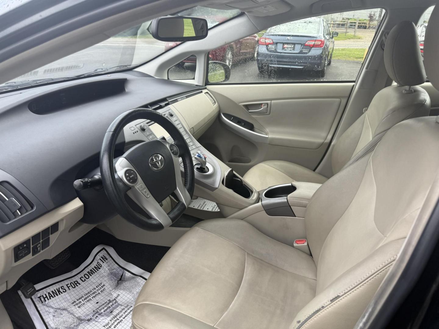 2015 Black /Brown Toyota Prius Four (JTDKN3DU9F1) with an 1.8L I4 DOHC 16V HYBRID engine, Automatic transmission, located at 11115 Chardon Rd. , Chardon, OH, 44024, (440) 214-9705, 41.580246, -81.241943 - This 2015 Toyota Prius Four is a desirable trim level for those seeking both efficiency and luxury features. It boasts a leather interior and heated front seats, providing comfort and a premium feel. The vehicle's technology includes a 6.1-inch touchscreen, which facilitates access to its navigation - Photo#3