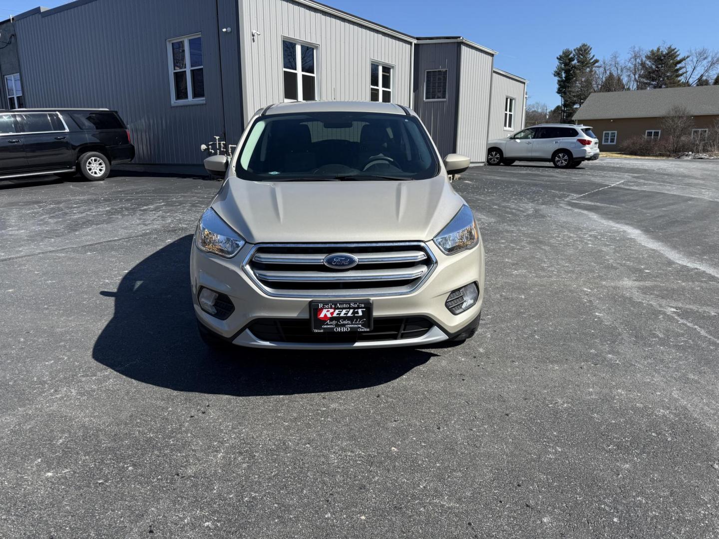 2017 Gold /Black Ford Escape SE 4WD (1FMCU9GD9HU) with an 1.5L I4 DOHC 16V Turbo engine, 6A transmission, located at 11115 Chardon Rd. , Chardon, OH, 44024, (440) 214-9705, 41.580246, -81.241943 - This One Owner 2017 Ford Escape SE 4WD is a versatile compact SUV equipped with a 1.5L I4 EcoBoost engine and a 6-speed automatic transmission, providing an efficient and smooth driving experience with 28 MPG on the highway. It features a power driver's seat for personalized comfort and a backup cam - Photo#1