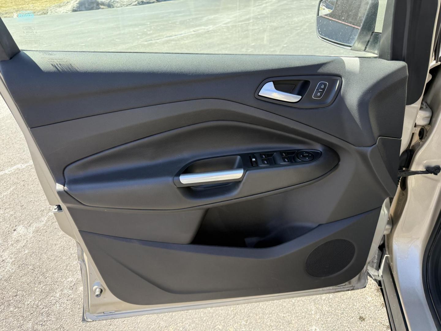 2017 Gold /Black Ford Escape SE 4WD (1FMCU9GD9HU) with an 1.5L I4 DOHC 16V Turbo engine, 6A transmission, located at 11115 Chardon Rd. , Chardon, OH, 44024, (440) 214-9705, 41.580246, -81.241943 - This One Owner 2017 Ford Escape SE 4WD is a versatile compact SUV equipped with a 1.5L I4 EcoBoost engine and a 6-speed automatic transmission, providing an efficient and smooth driving experience with 28 MPG on the highway. It features a power driver's seat for personalized comfort and a backup cam - Photo#16