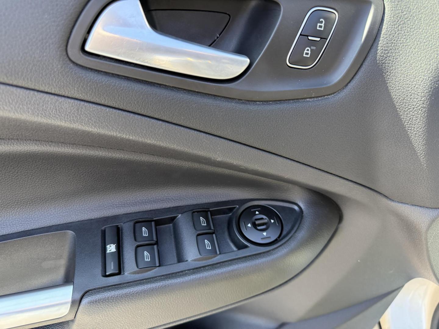 2017 Gold /Black Ford Escape SE 4WD (1FMCU9GD9HU) with an 1.5L I4 DOHC 16V Turbo engine, 6A transmission, located at 11115 Chardon Rd. , Chardon, OH, 44024, (440) 214-9705, 41.580246, -81.241943 - This One Owner 2017 Ford Escape SE 4WD is a versatile compact SUV equipped with a 1.5L I4 EcoBoost engine and a 6-speed automatic transmission, providing an efficient and smooth driving experience with 28 MPG on the highway. It features a power driver's seat for personalized comfort and a backup cam - Photo#17