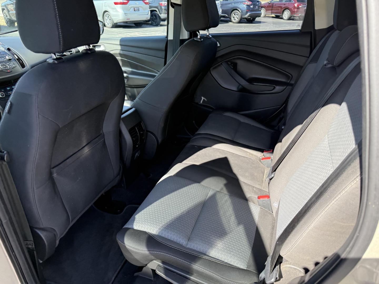 2017 Gold /Black Ford Escape SE 4WD (1FMCU9GD9HU) with an 1.5L I4 DOHC 16V Turbo engine, 6A transmission, located at 11115 Chardon Rd. , Chardon, OH, 44024, (440) 214-9705, 41.580246, -81.241943 - This One Owner 2017 Ford Escape SE 4WD is a versatile compact SUV equipped with a 1.5L I4 EcoBoost engine and a 6-speed automatic transmission, providing an efficient and smooth driving experience with 28 MPG on the highway. It features a power driver's seat for personalized comfort and a backup cam - Photo#28