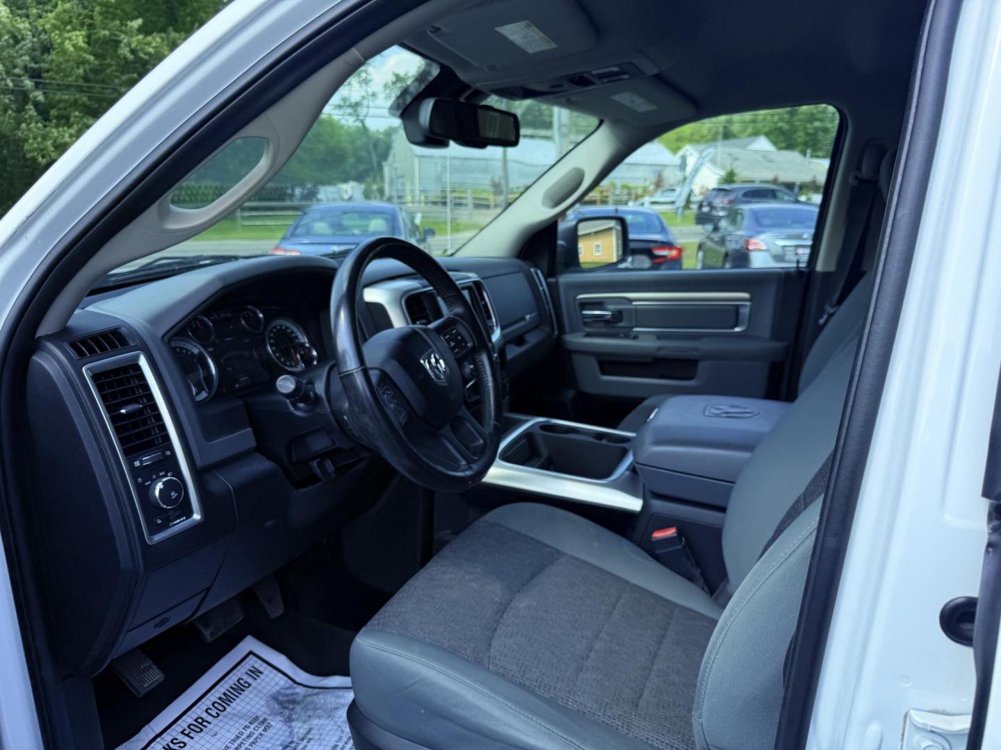 2016 White /Gray RAM 1500 Big Horn Crew Cab SWB 4WD (3C6RR7LT6GG) with an 5.7L V8 OHV 16V engine, 8-Speed Automatic transmission, located at 547 E. Main St., Orwell, OH, 44076, (440) 437-5893, 41.535435, -80.847855 - This 2016 Ram 1500 Big Horn Crew Cab is equipped with a robust 5.7L HEMI V8 engine paired with an 8-speed automatic transmission, offering a powerful performance and a 8,010-pound towing capacity. It features a comfortable interior with a power driver's seat and heated front seats, and is enhanced w - Photo#9