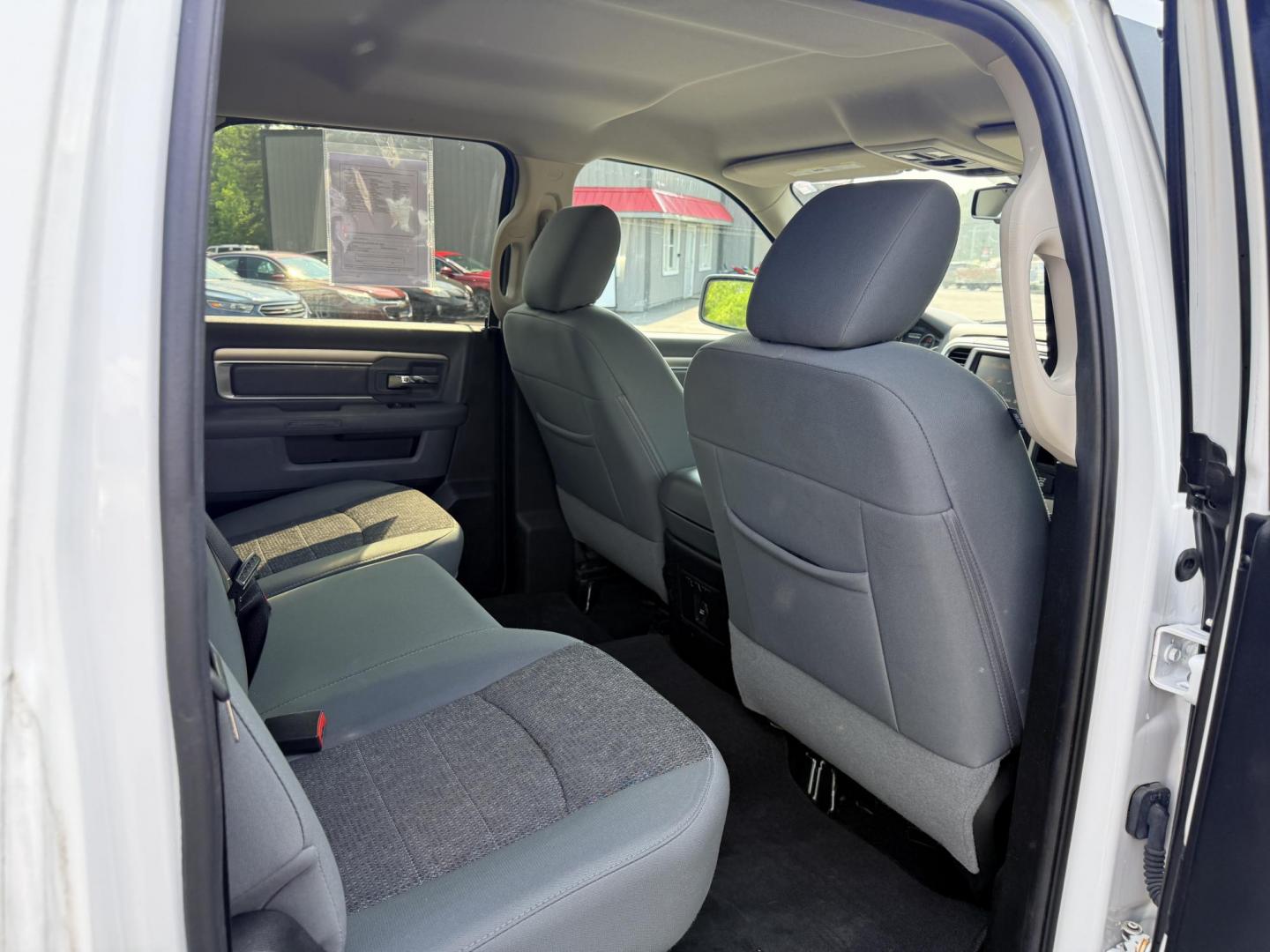 2016 White /Gray RAM 1500 Big Horn Crew Cab SWB 4WD (3C6RR7LT6GG) with an 5.7L V8 OHV 16V engine, 8-Speed Automatic transmission, located at 547 E. Main St., Orwell, OH, 44076, (440) 437-5893, 41.535435, -80.847855 - This 2016 Ram 1500 Big Horn Crew Cab is equipped with a robust 5.7L HEMI V8 engine paired with an 8-speed automatic transmission, offering a powerful performance and a 8,010-pound towing capacity. It features a comfortable interior with a power driver's seat and heated front seats, and is enhanced w - Photo#27