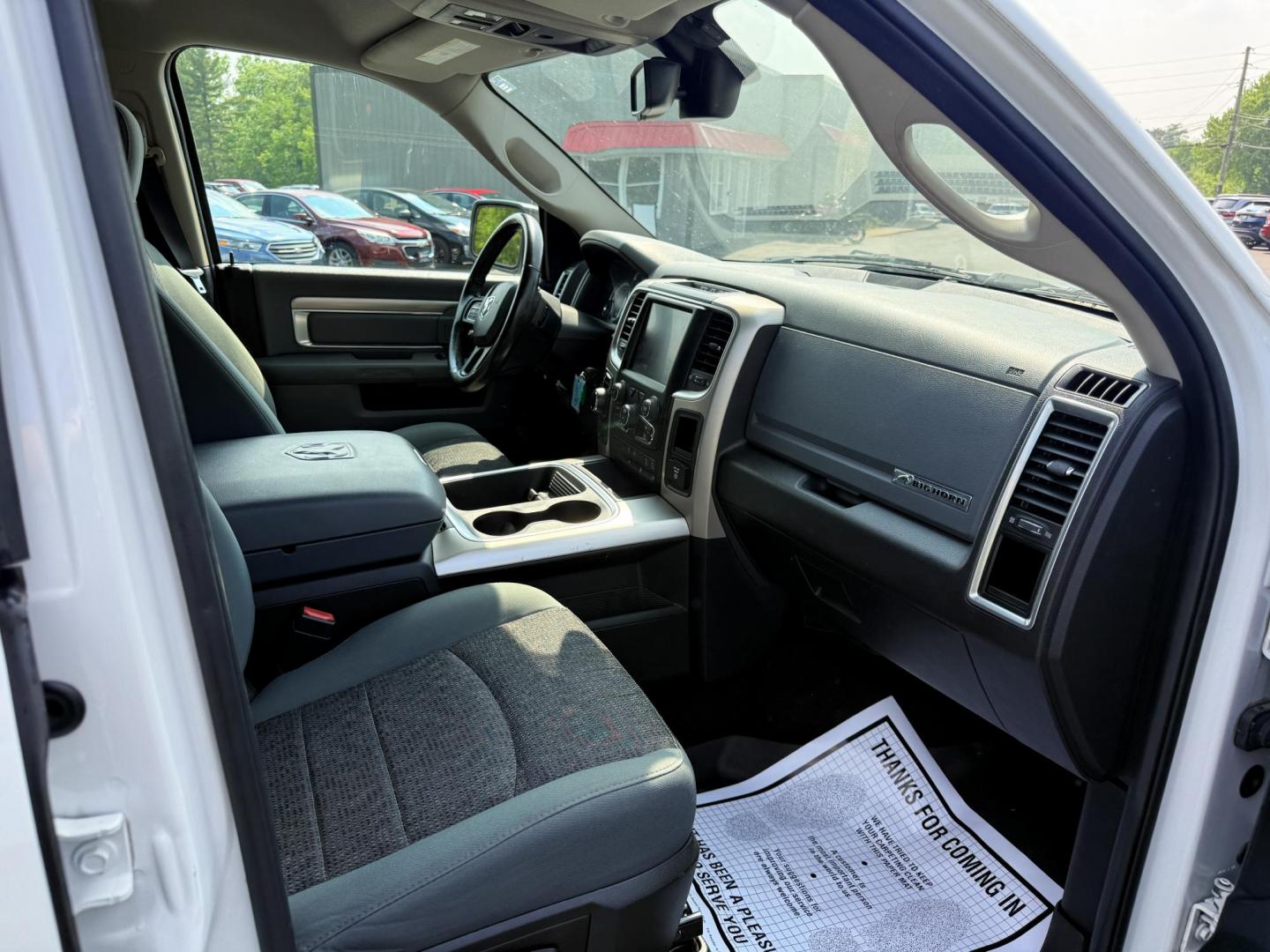 2016 White /Gray RAM 1500 Big Horn Crew Cab SWB 4WD (3C6RR7LT6GG) with an 5.7L V8 OHV 16V engine, 8-Speed Automatic transmission, located at 547 E. Main St., Orwell, OH, 44076, (440) 437-5893, 41.535435, -80.847855 - This 2016 Ram 1500 Big Horn Crew Cab is equipped with a robust 5.7L HEMI V8 engine paired with an 8-speed automatic transmission, offering a powerful performance and a 8,010-pound towing capacity. It features a comfortable interior with a power driver's seat and heated front seats, and is enhanced w - Photo#35