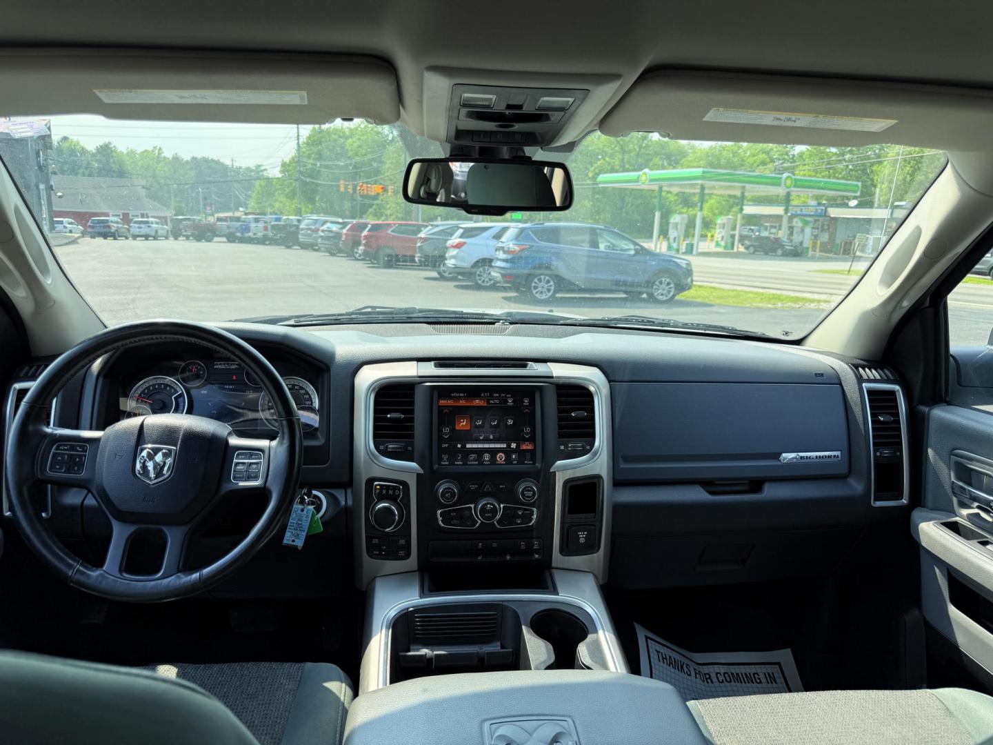 2016 White /Gray RAM 1500 Big Horn Crew Cab SWB 4WD (3C6RR7LT6GG) with an 5.7L V8 OHV 16V engine, 8-Speed Automatic transmission, located at 547 E. Main St., Orwell, OH, 44076, (440) 437-5893, 41.535435, -80.847855 - This 2016 Ram 1500 Big Horn Crew Cab is equipped with a robust 5.7L HEMI V8 engine paired with an 8-speed automatic transmission, offering a powerful performance and a 8,010-pound towing capacity. It features a comfortable interior with a power driver's seat and heated front seats, and is enhanced w - Photo#29